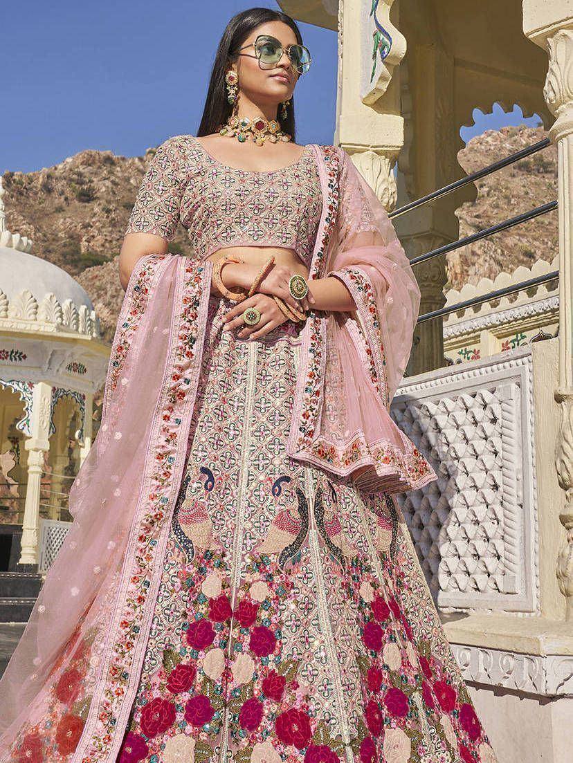 Pink floral embroidered lehenga choli with peacock motifs, perfect for Indian weddings and festive occasions.
