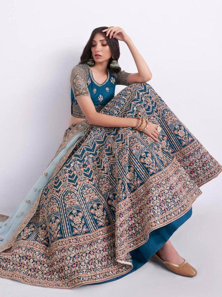 Sumptuous Teal Blue Cording Work Net Bridal Lehenga Choli