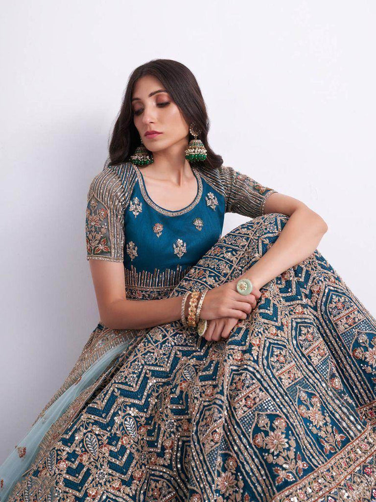 Sumptuous Teal Blue Cording Work Net Bridal Lehenga Choli