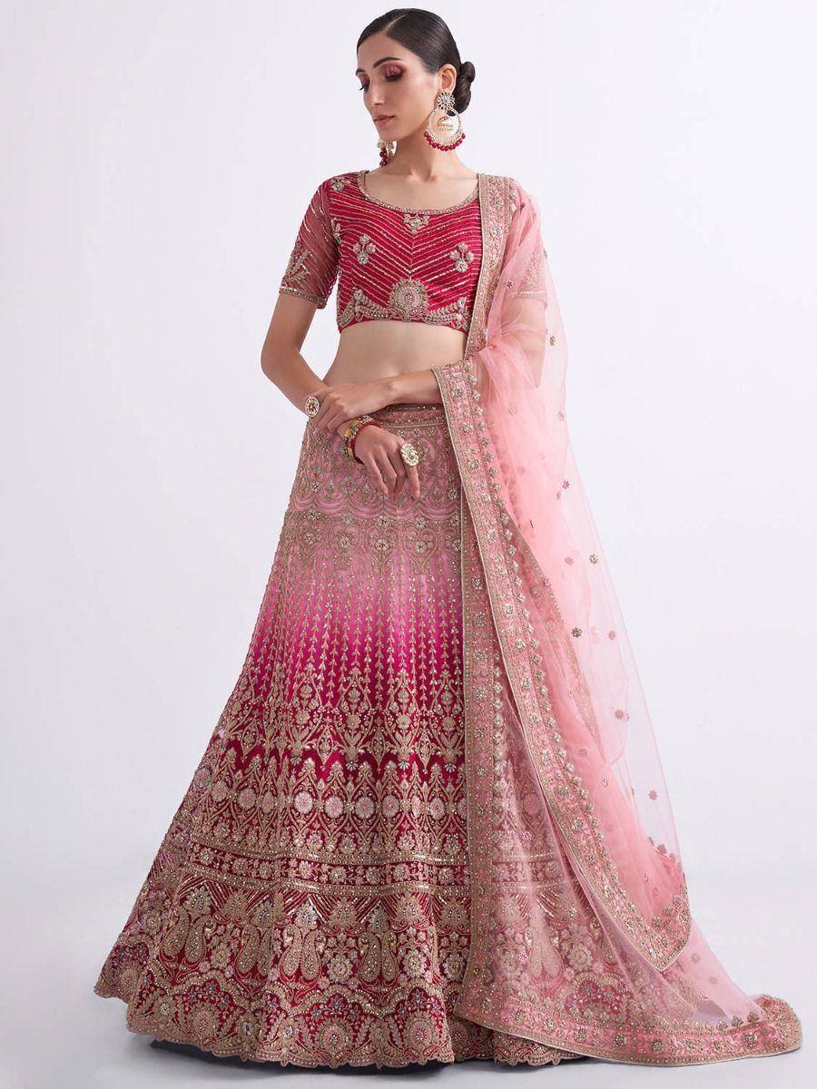 Pink and red embroidered lehenga choli with gold detailing and matching dupatta, perfect for Indian weddings and festive occasions.