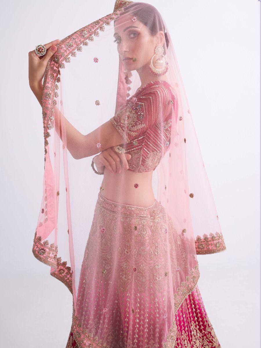 Pink embroidered lehenga choli with matching dupatta, perfect for Indian weddings and festive occasions.