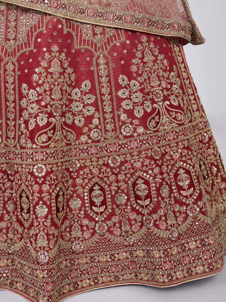 Red embroidered lehenga with gold floral motifs and mirror work, ideal for Indian weddings and festivals