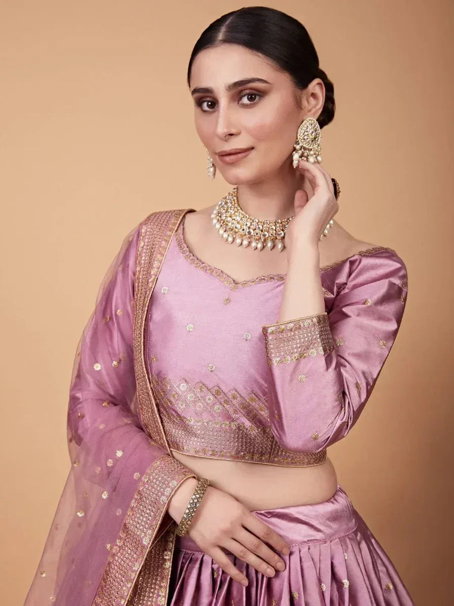 Pink designer lehenga choli with gold embroidery, perfect for Indian ethnic wear and festive occasions.