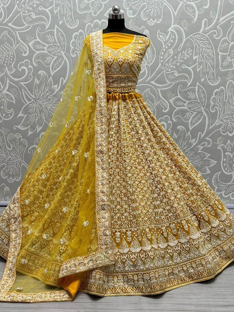 Stunning Yellow Thread Embroidered Net Lehenga Choli