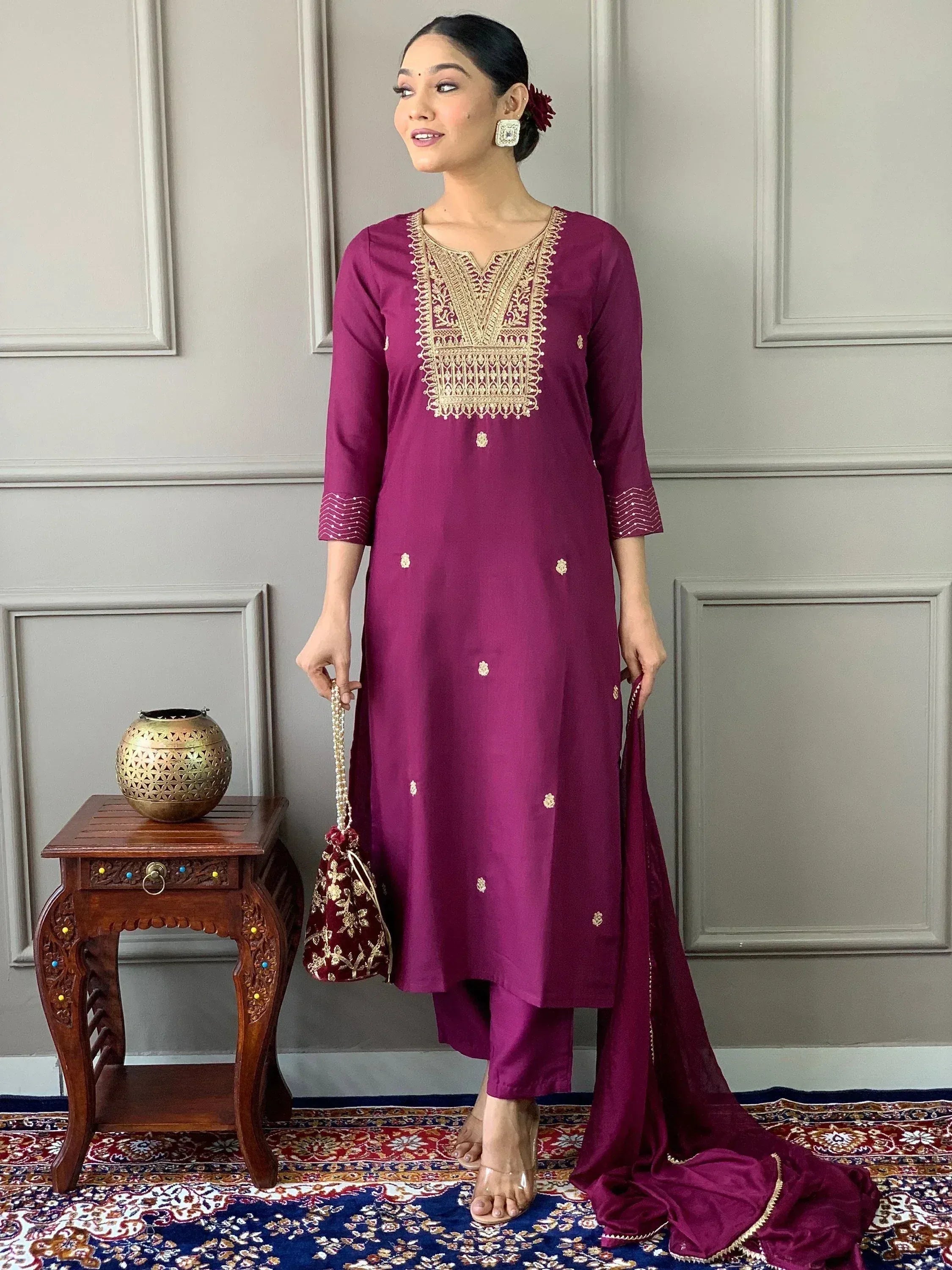 Elegant maroon ethnic kurta with gold embroidery, paired with matching palazzo and dupatta for Indian wear
