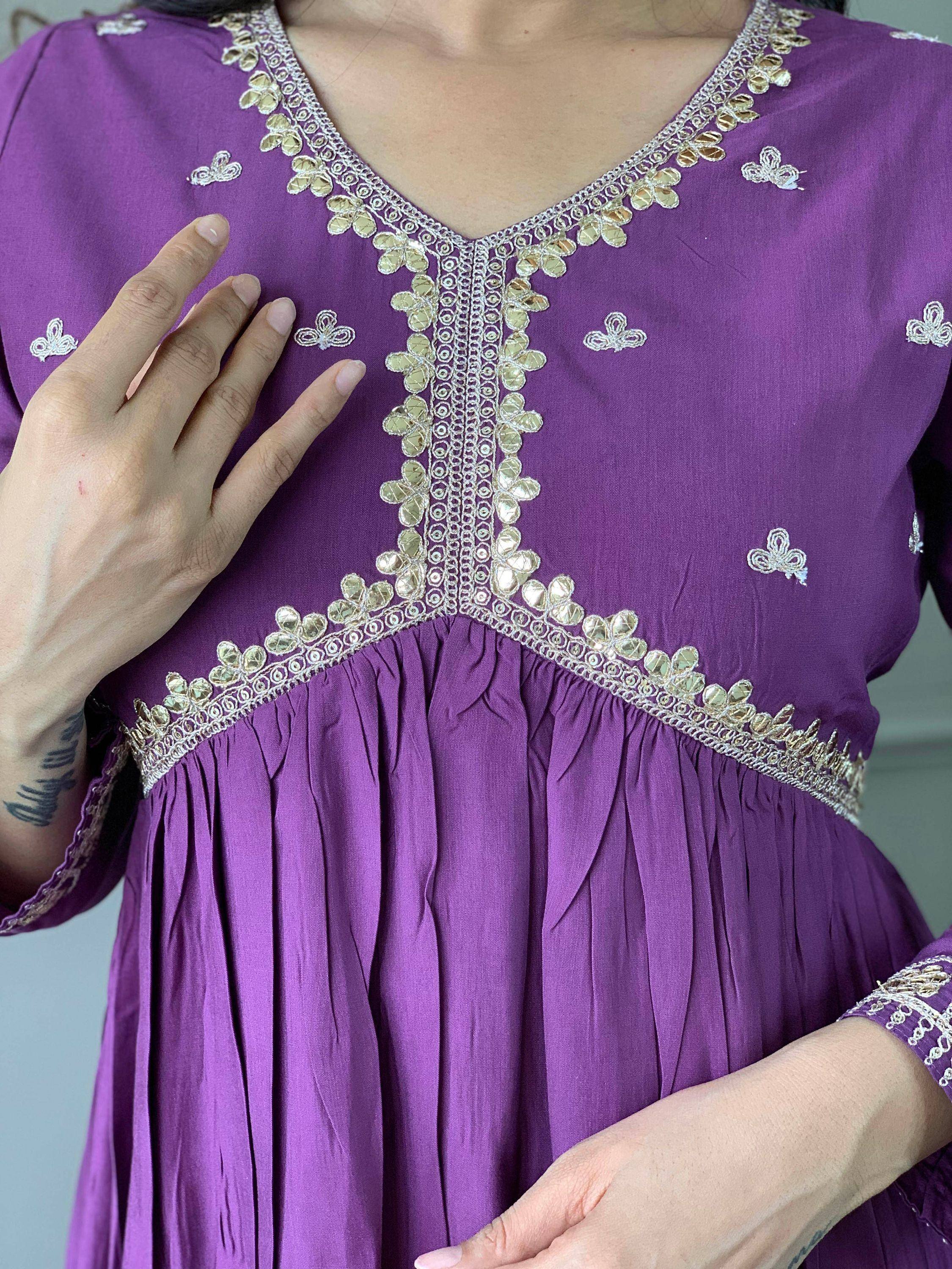 Purple ethnic gown with gold and silver embroidery, perfect for Indian wear and festive occasions.