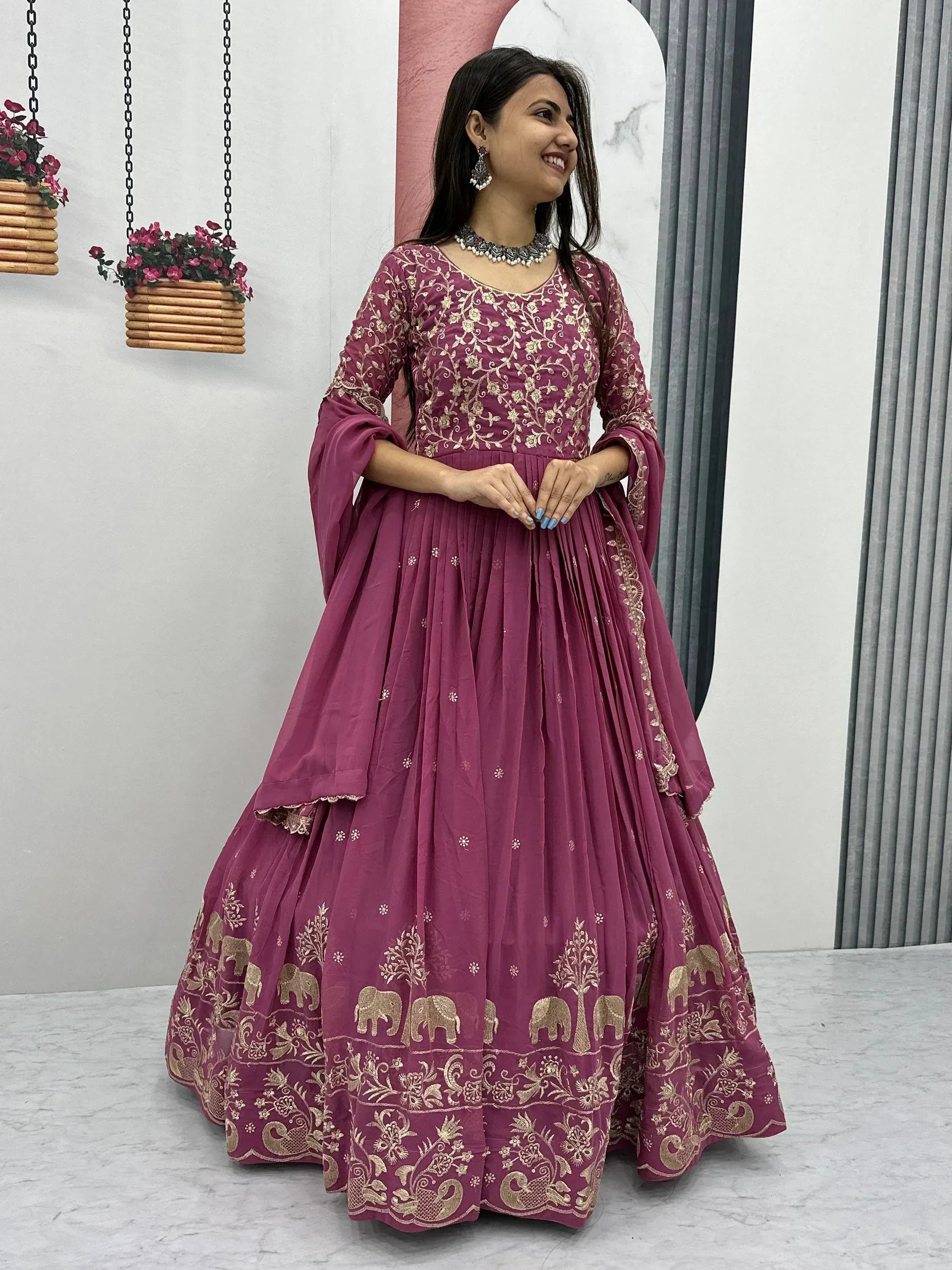 Purple Indian ethnic anarkali gown with gold elephant and floral embroidery, perfect for festive occasions.