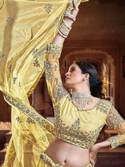 Fascinating Yellow Sequins Embroidered Net Wedding Wear Lehenga Choli