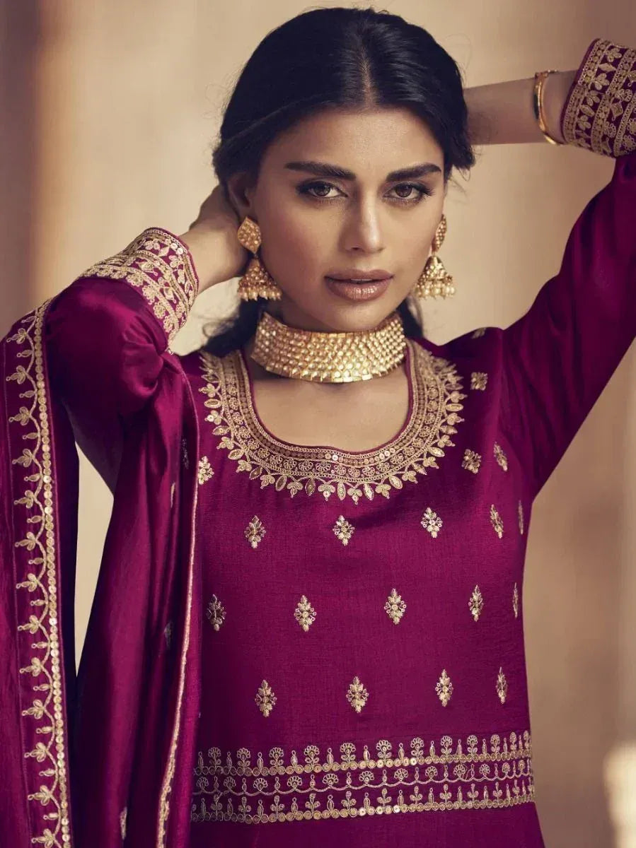 Maroon ethnic kurti with gold embroidery, matching dupatta, and traditional jewelry for Indian wear