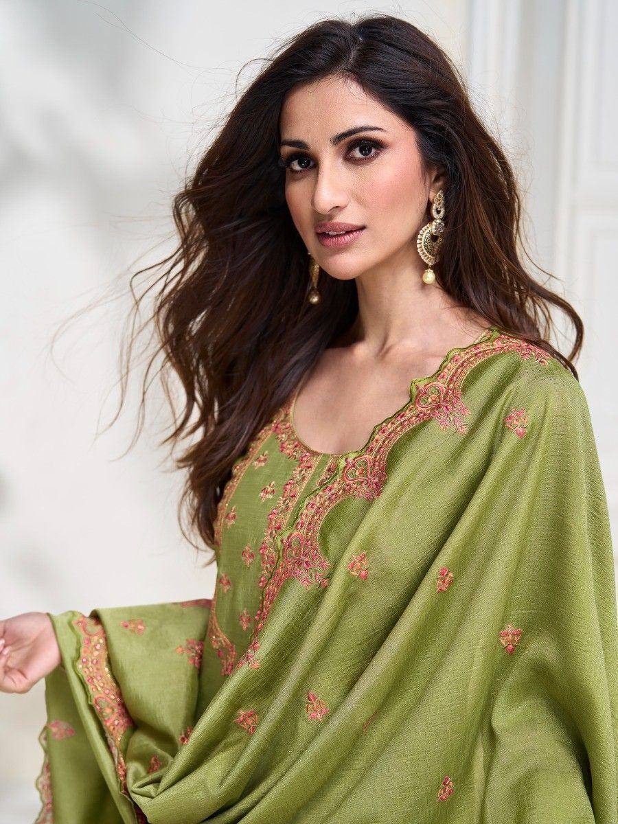 Olive green embroidered salwar kameez with pink floral detailing, perfect for ethnic wear