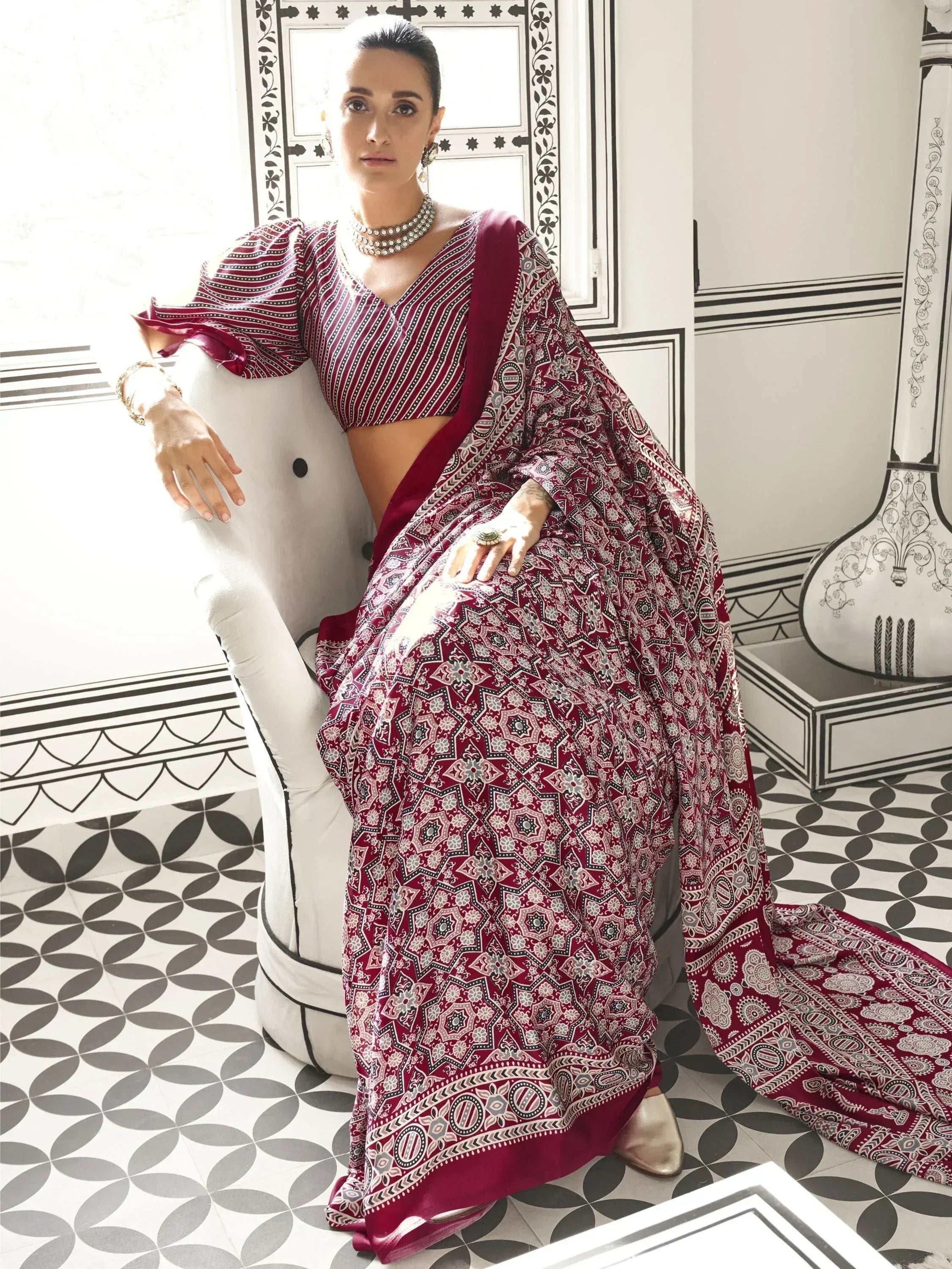 Woman in maroon printed lehenga choli with puff sleeves, ethnic wear for festive occasions
