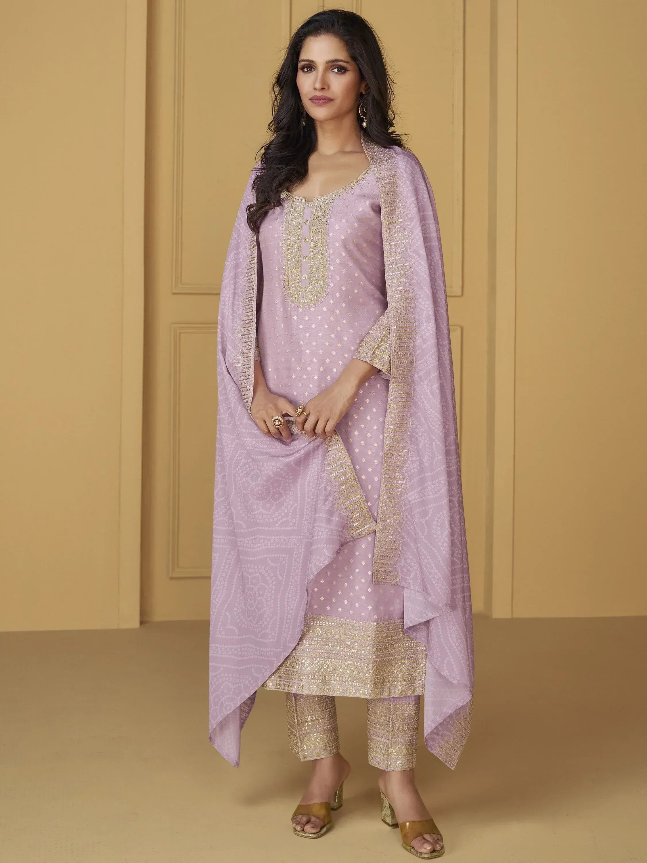 Lavender ethnic salwar kameez with gold embroidery and matching dupatta, perfect for Indian occasions