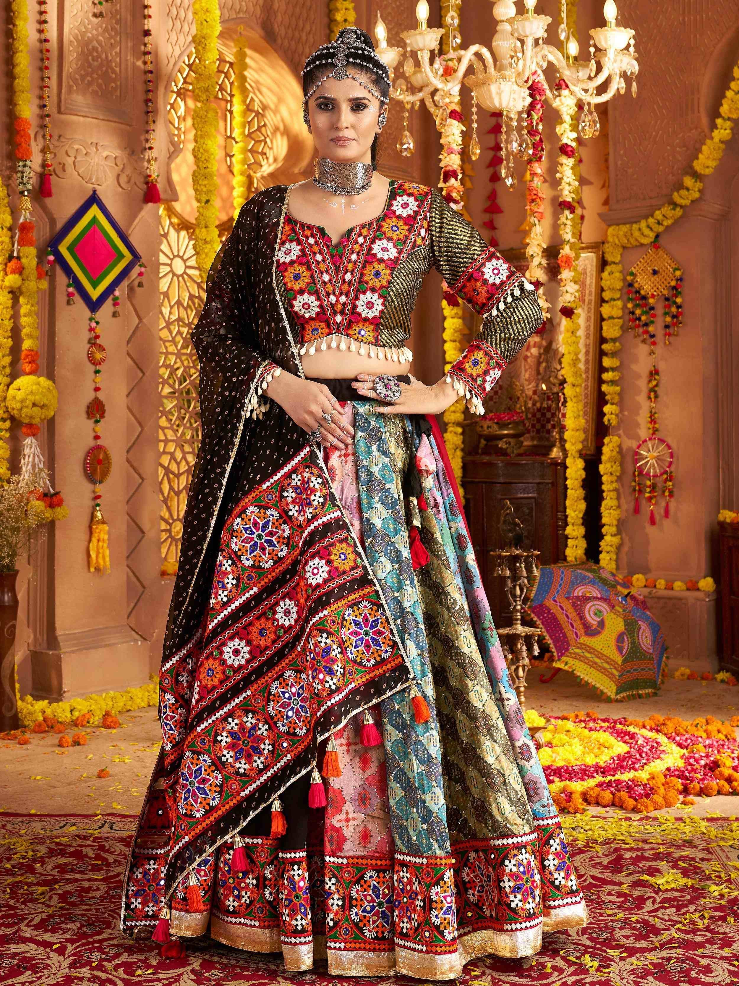 Woman in vibrant embroidered lehenga choli with mirror work, perfect for Indian ethnic wear occasions.