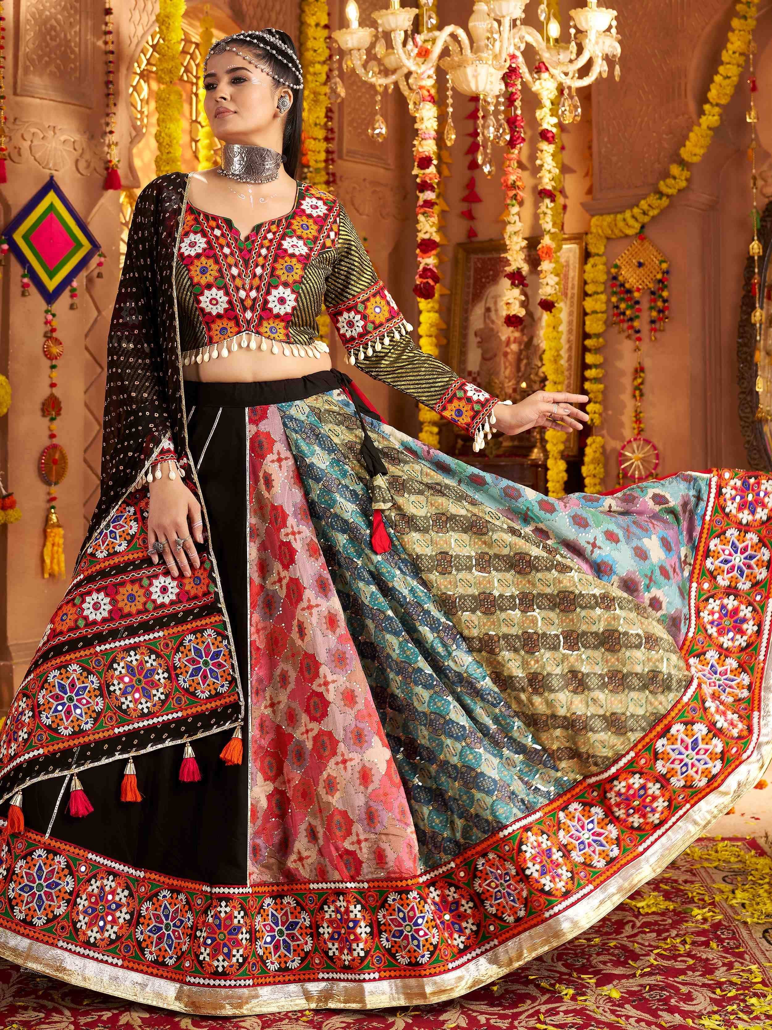 Woman in vibrant ethnic lehenga choli with mirror work, floral garlands, and traditional Indian jewelry