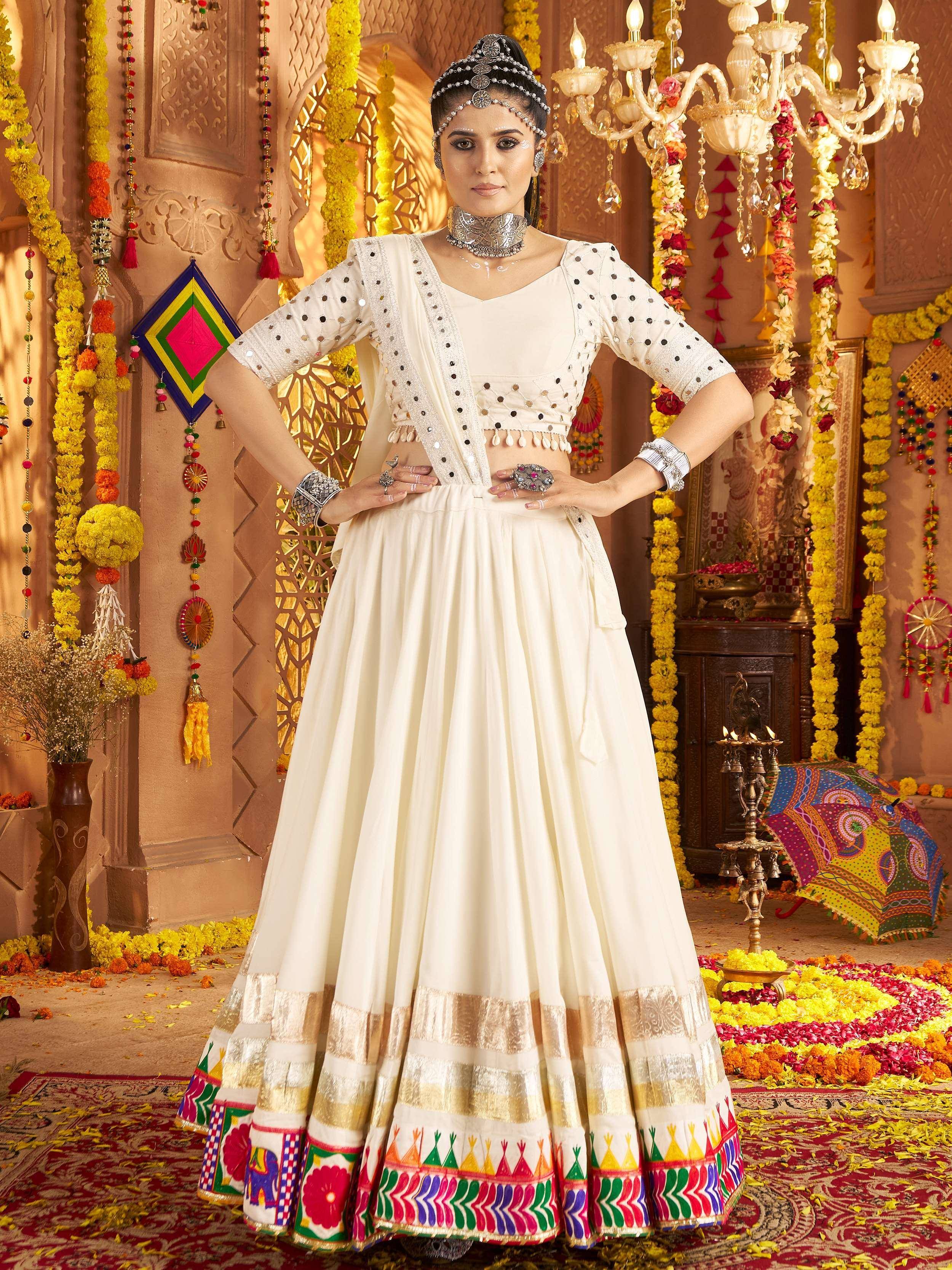 Elegant white lehenga choli with colorful embroidery, perfect for Indian weddings and festive occasions.