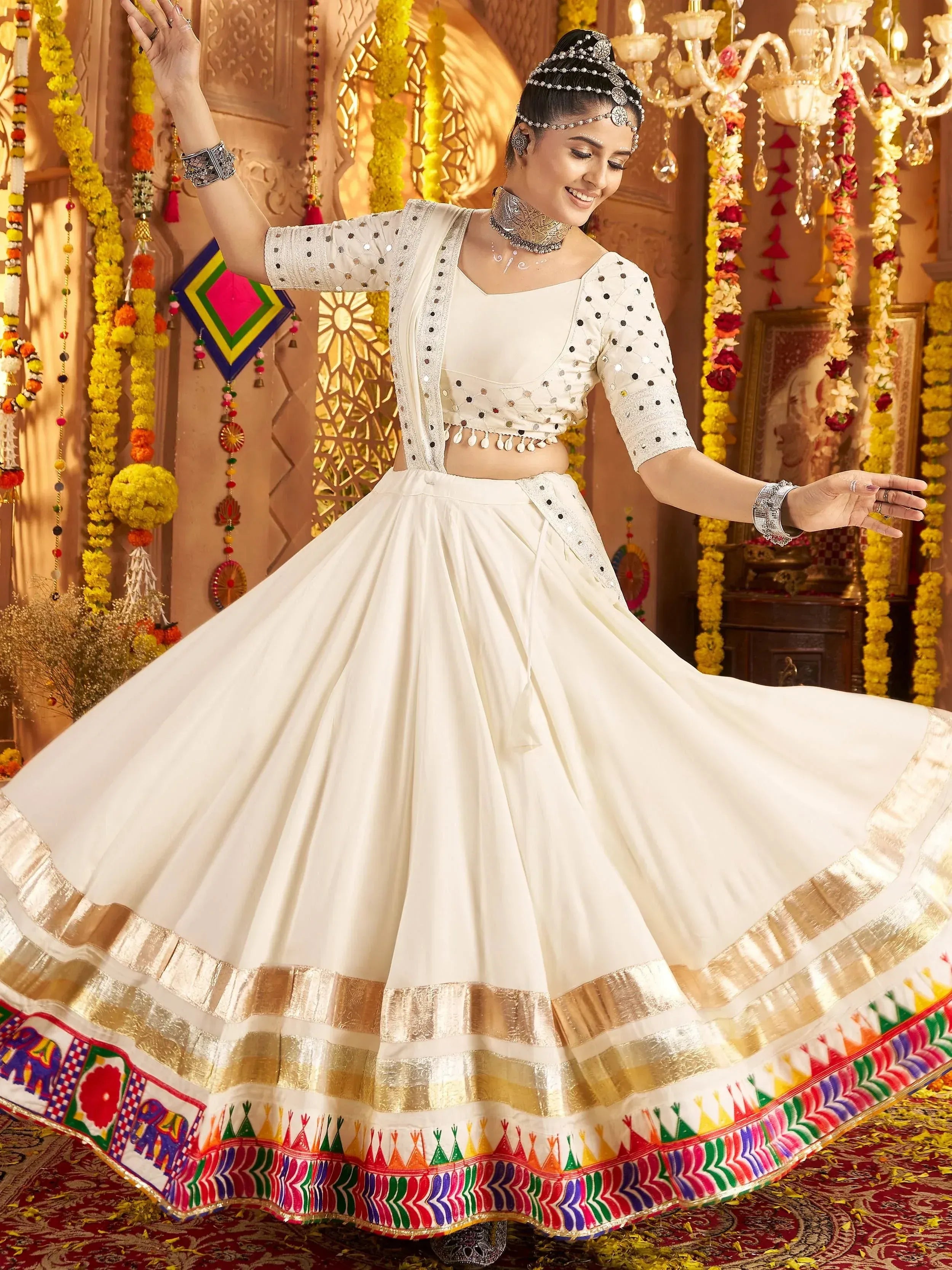 White embroidered lehenga choli with colorful border, perfect for Indian ethnic wear and festive occasions.