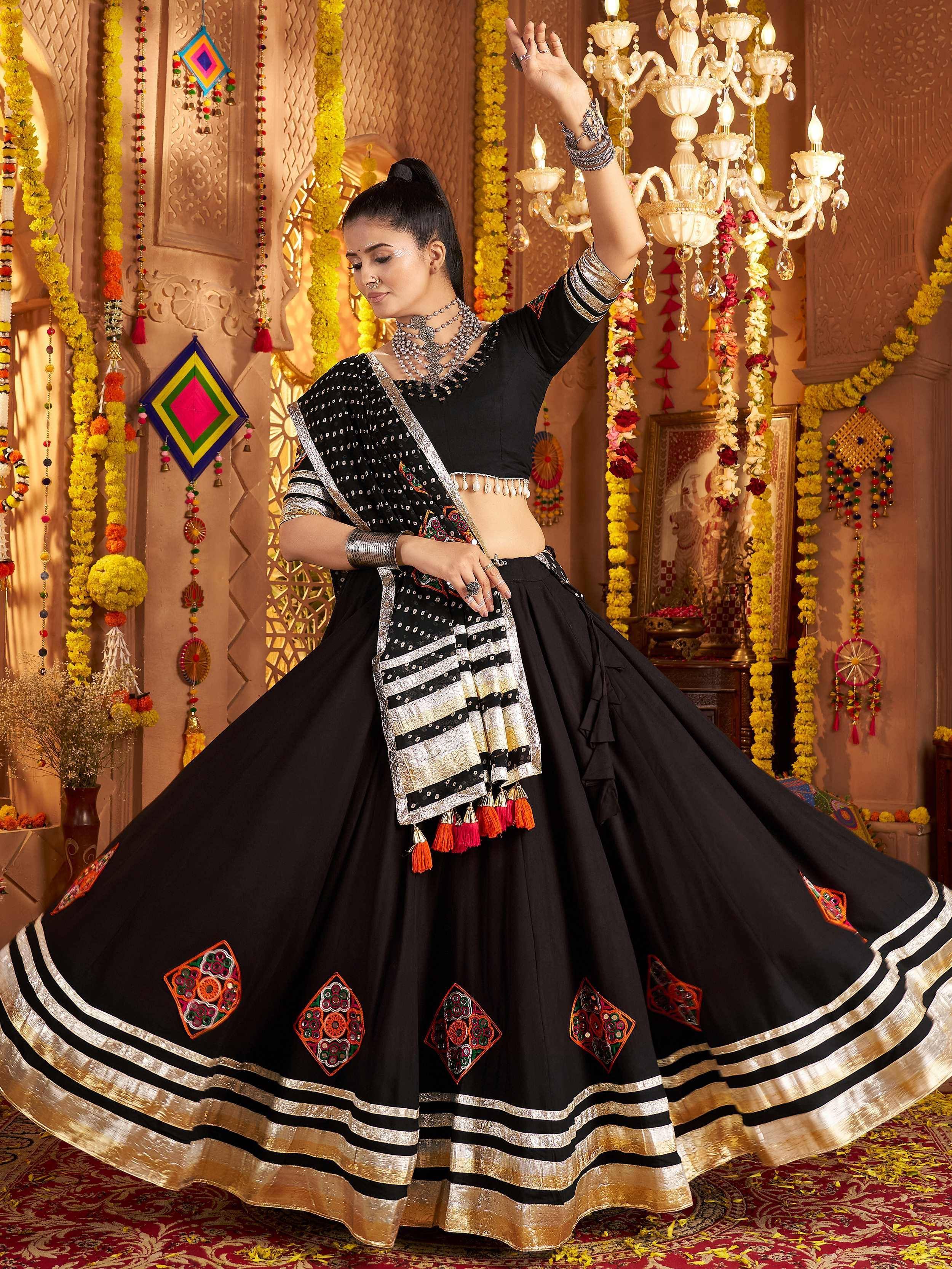 Black embroidered lehenga choli with mirror work, perfect for Indian ethnic wear and festive occasions.