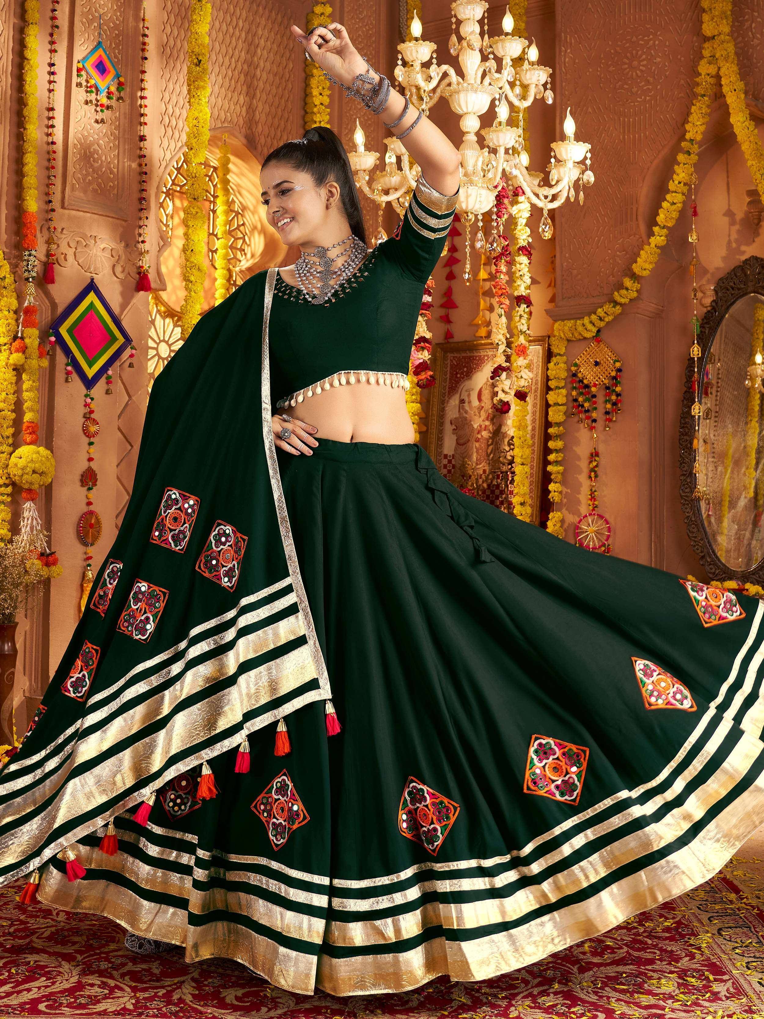 Green embroidered lehenga choli with mirror work, perfect for Indian ethnic wear and festive occasions.