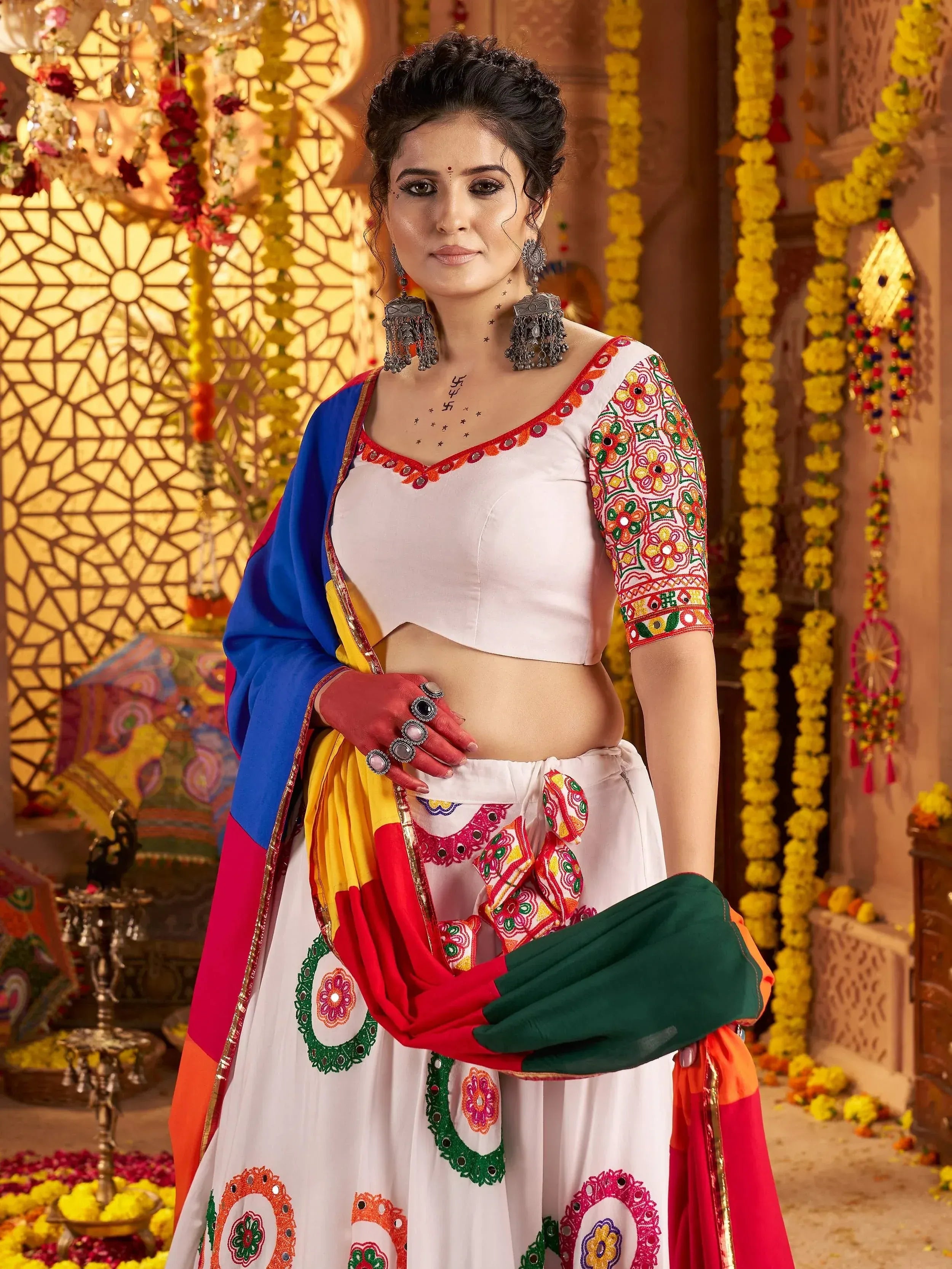 White embroidered lehenga choli with colorful dupatta, traditional Indian ethnic wear for festive occasions