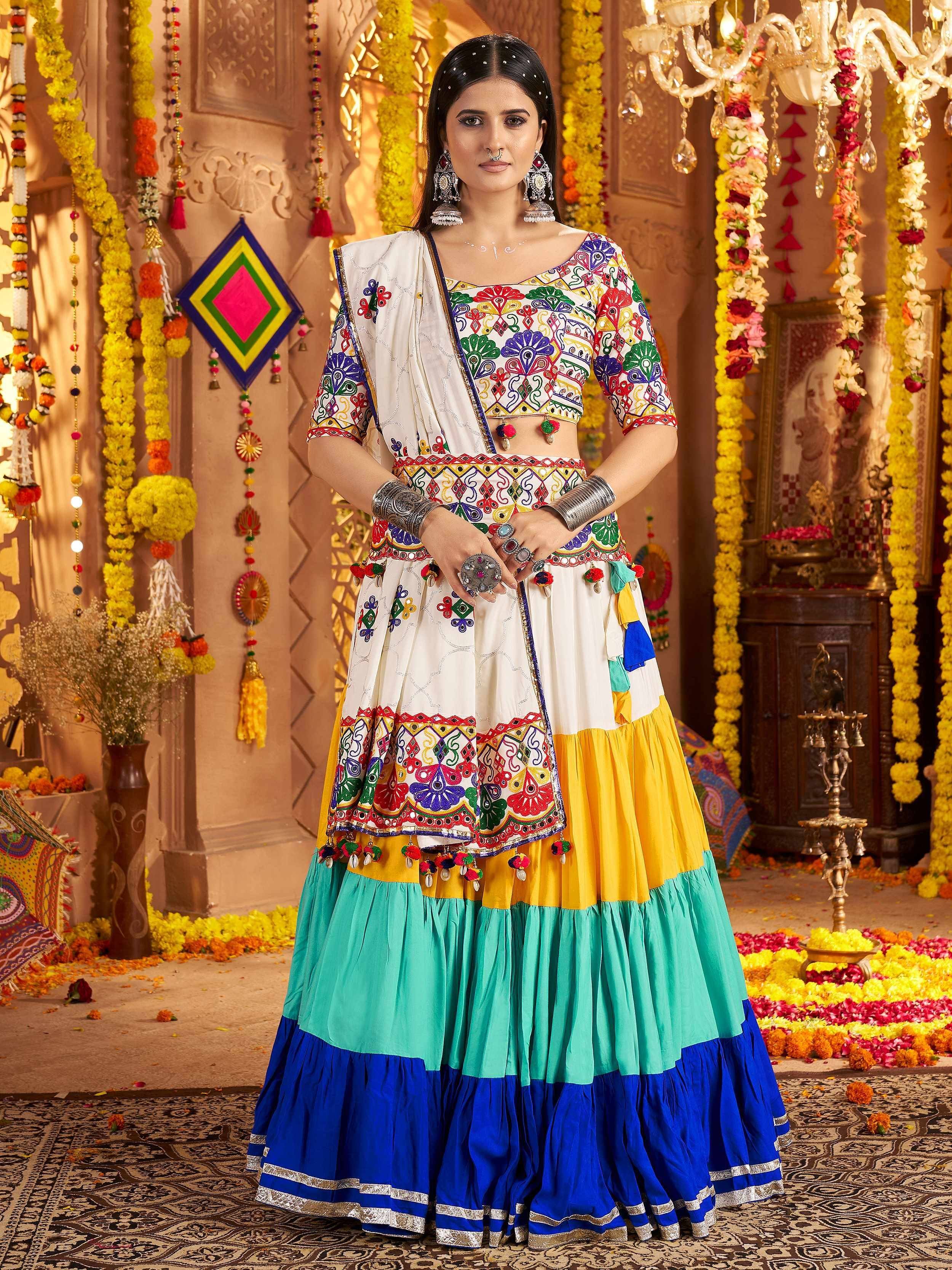 Colorful embroidered Indian lehenga choli with mirror work, perfect for festive occasions and weddings.