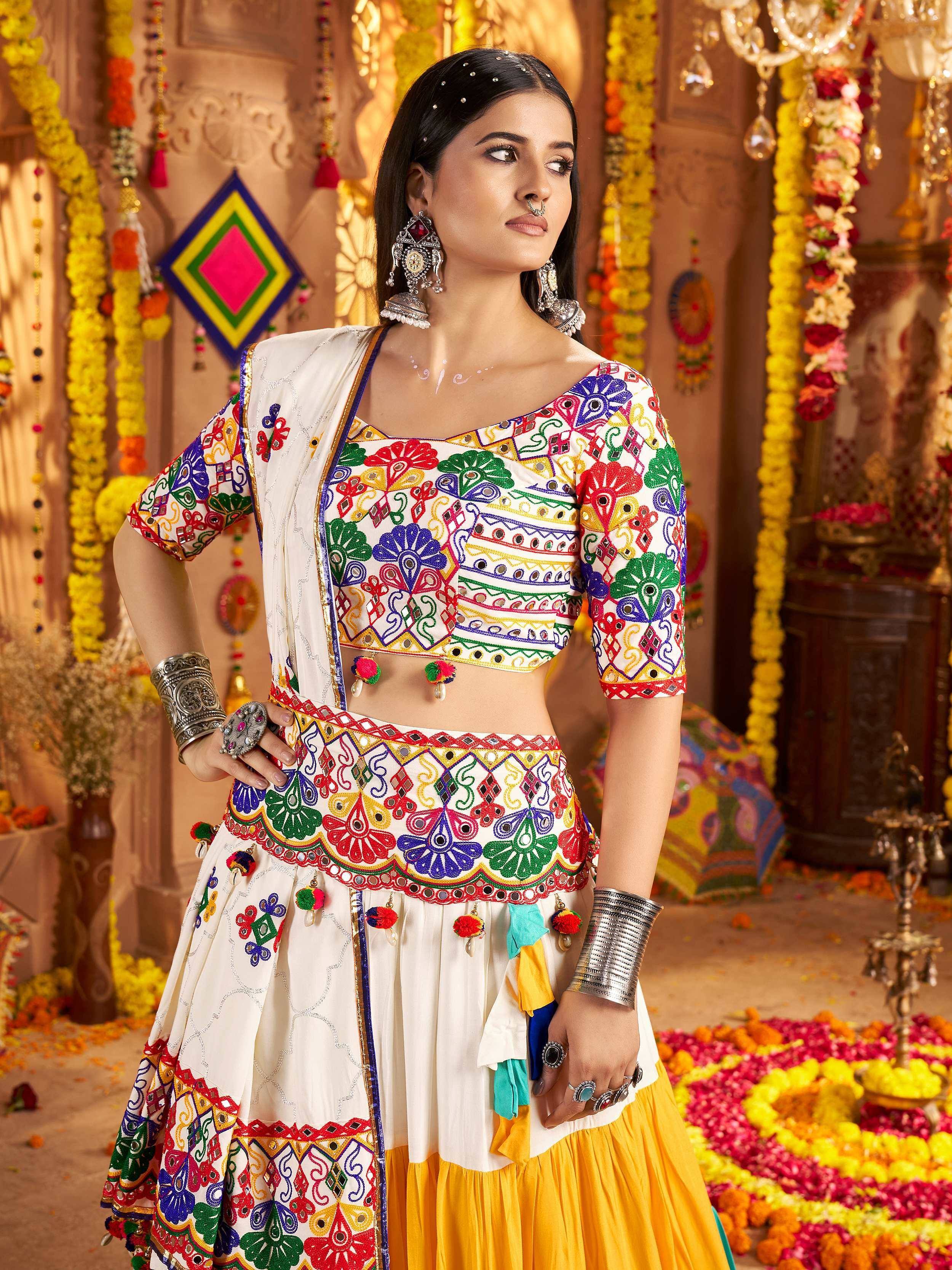 Colorful embroidered Indian ethnic lehenga choli with mirror work, perfect for festive occasions and celebrations.