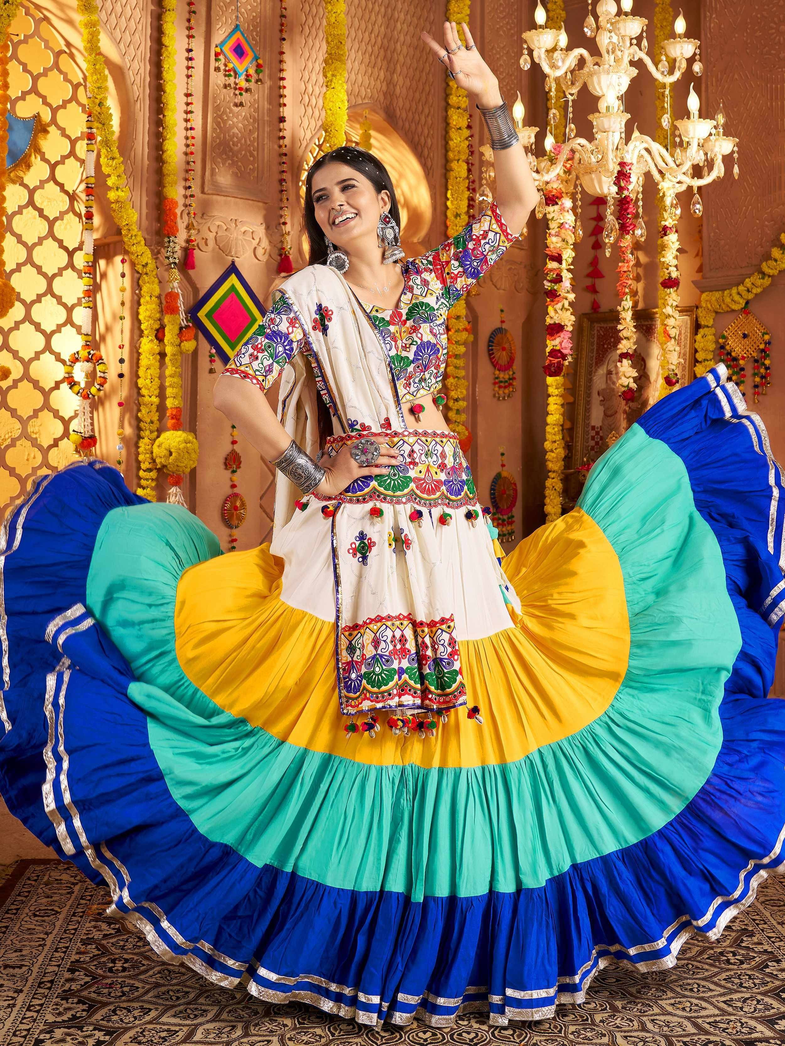 Colorful Indian ethnic wear with embroidered top and layered skirt, perfect for festive occasions and dance.