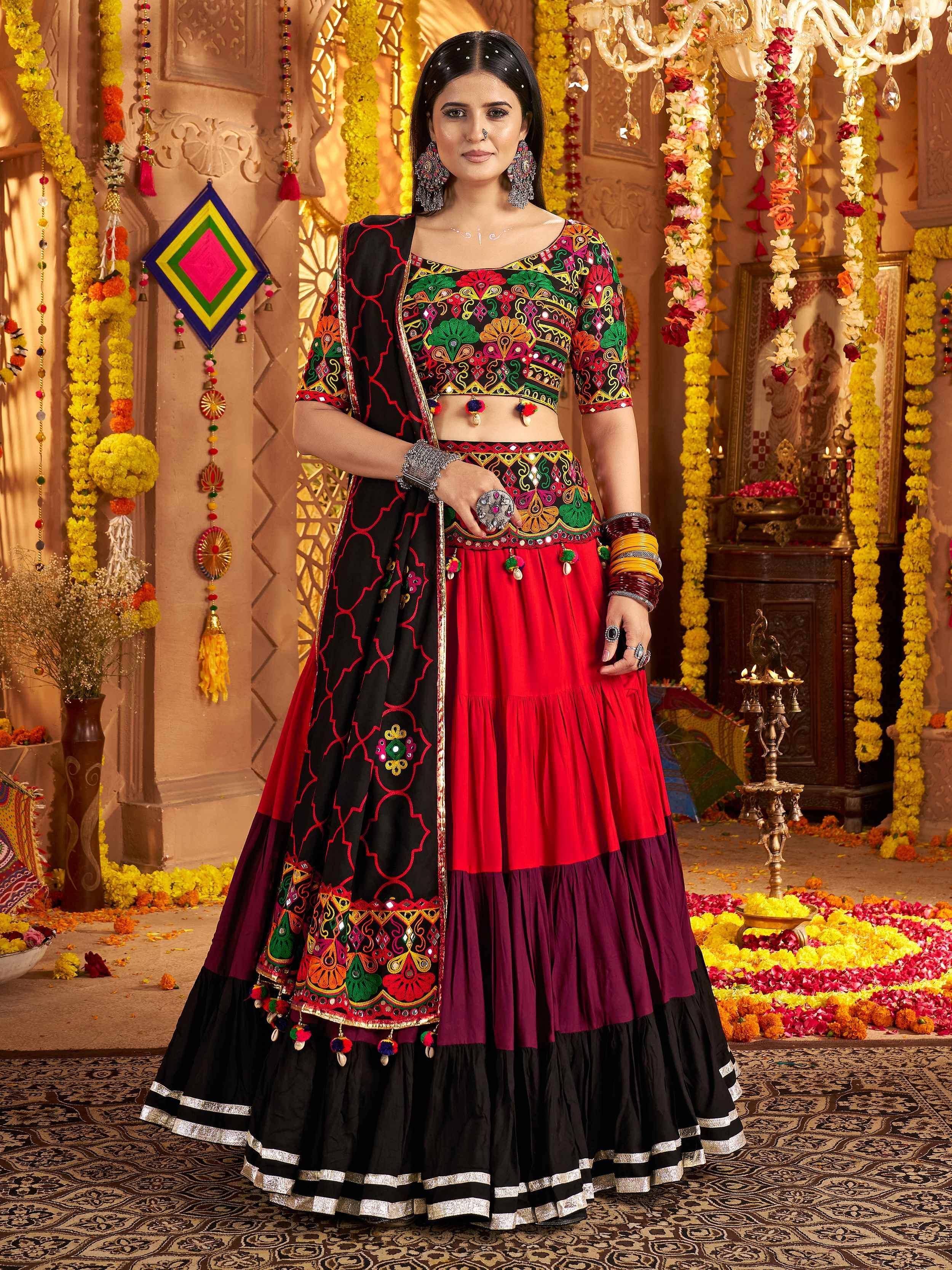 Vibrant red and black embroidered lehenga choli with mirror work, perfect for Indian festivals and weddings