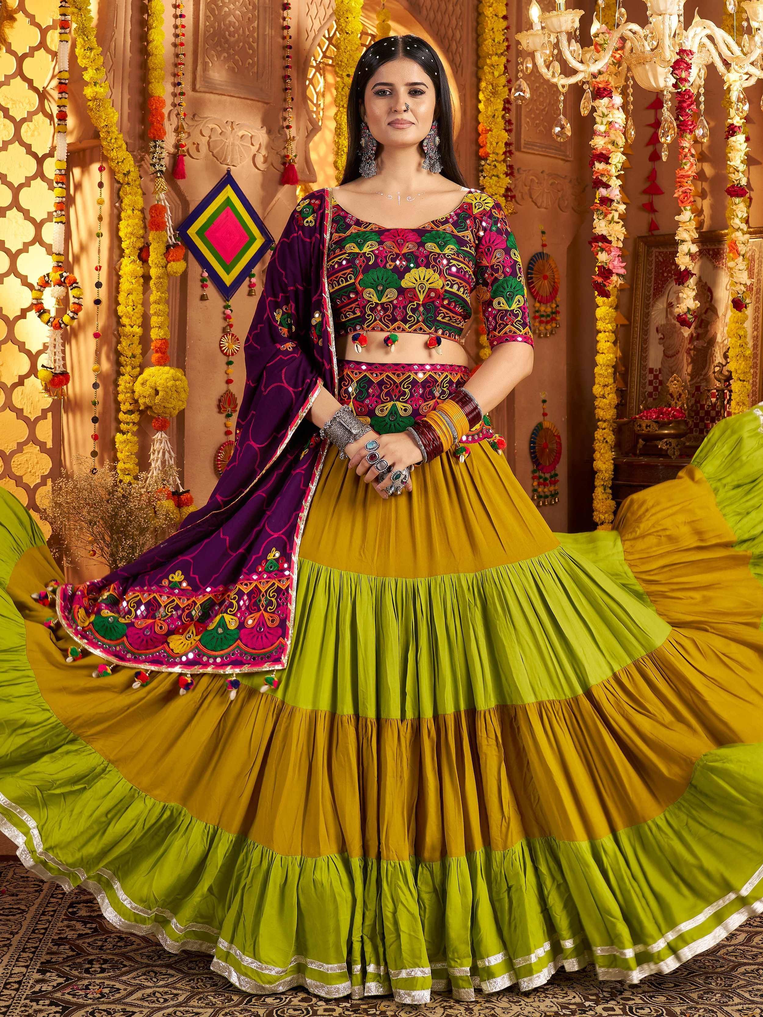 Vibrant Indian lehenga choli with mirror work, colorful embroidery, and layered skirt for festive occasions