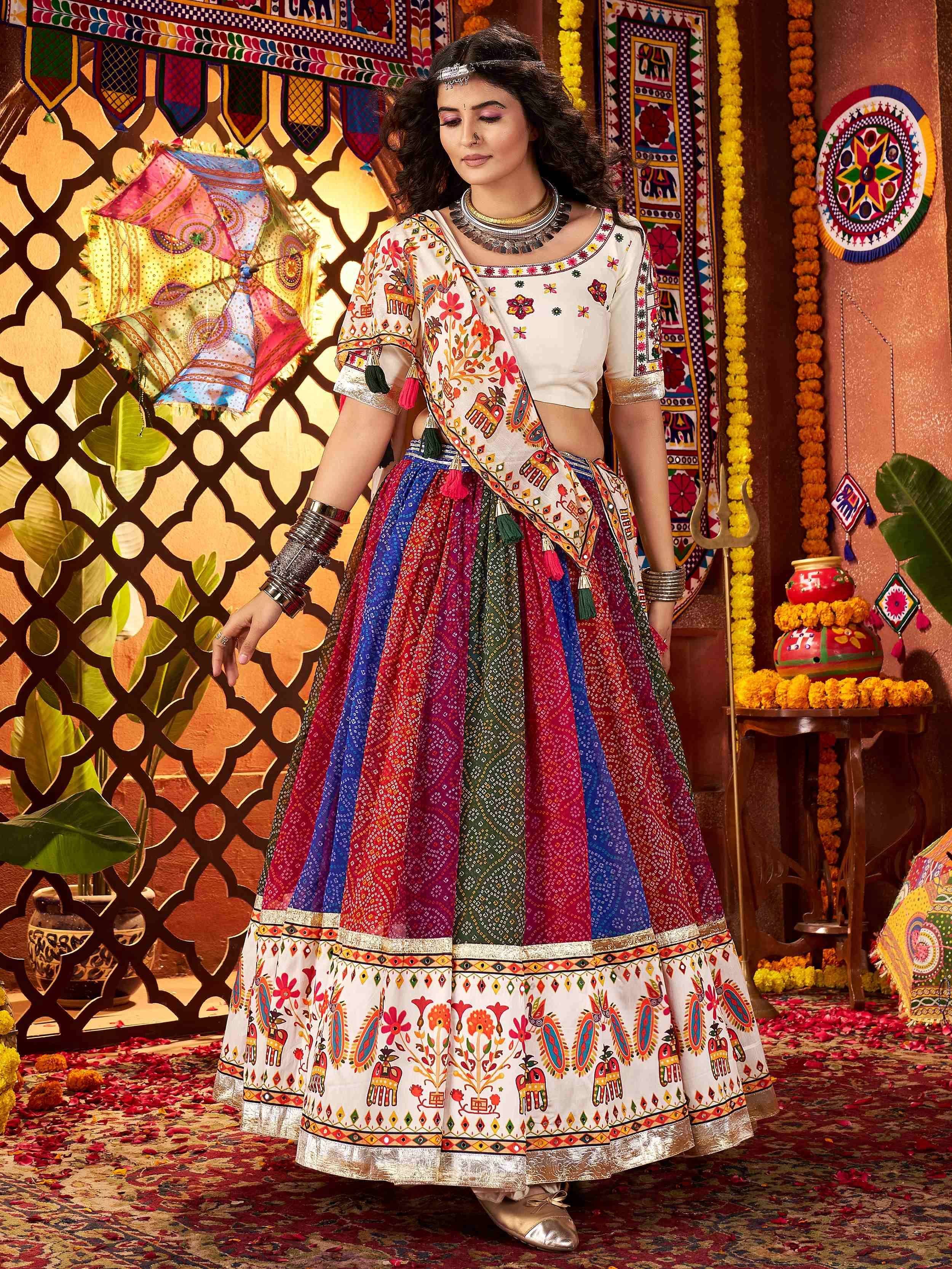Woman in colorful Indian ethnic lehenga choli with floral and elephant prints, traditional jewelry, festive backdrop