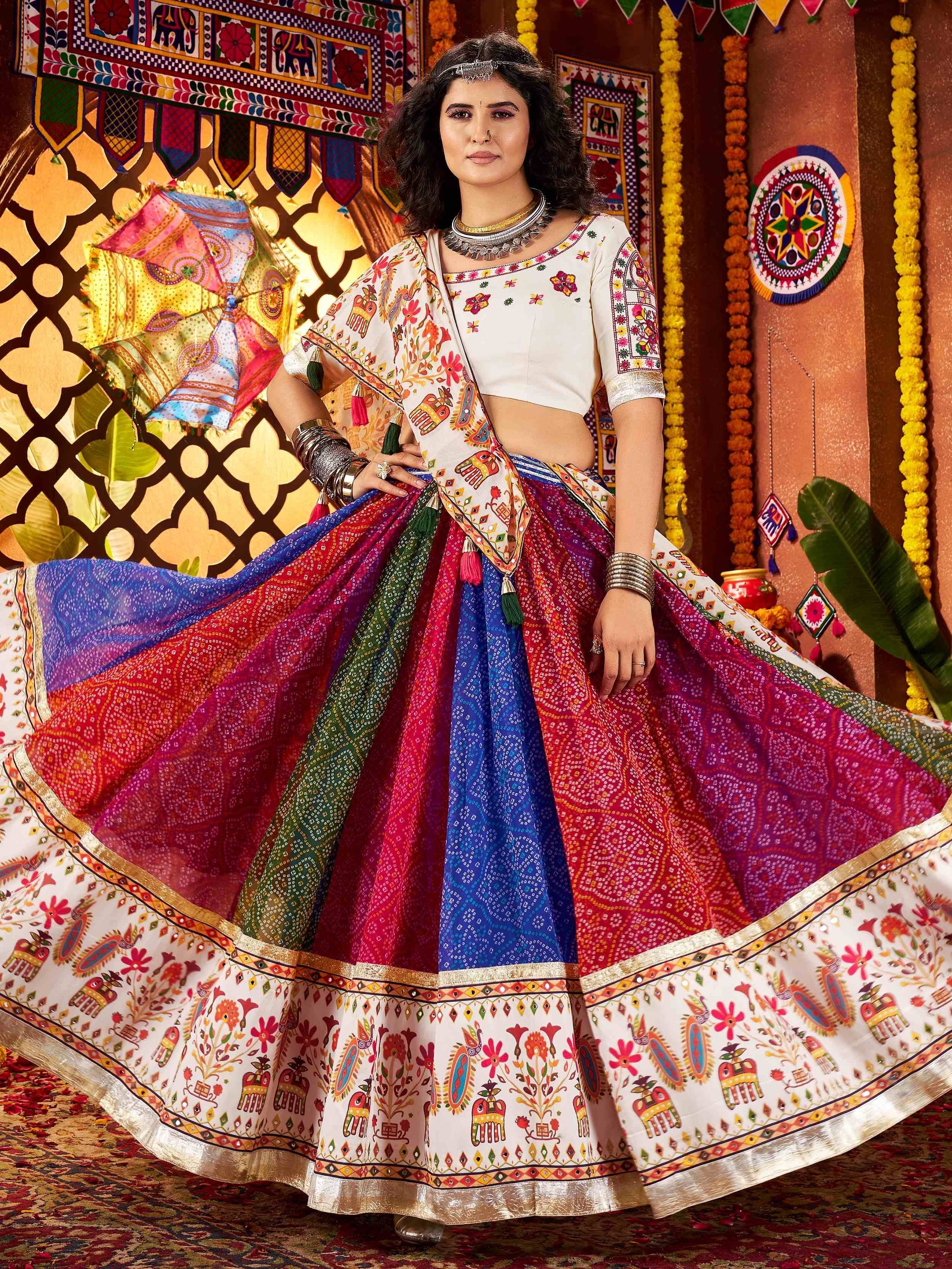 Woman in vibrant Indian lehenga choli with colorful printed skirt and embroidered blouse, festive ethnic wear