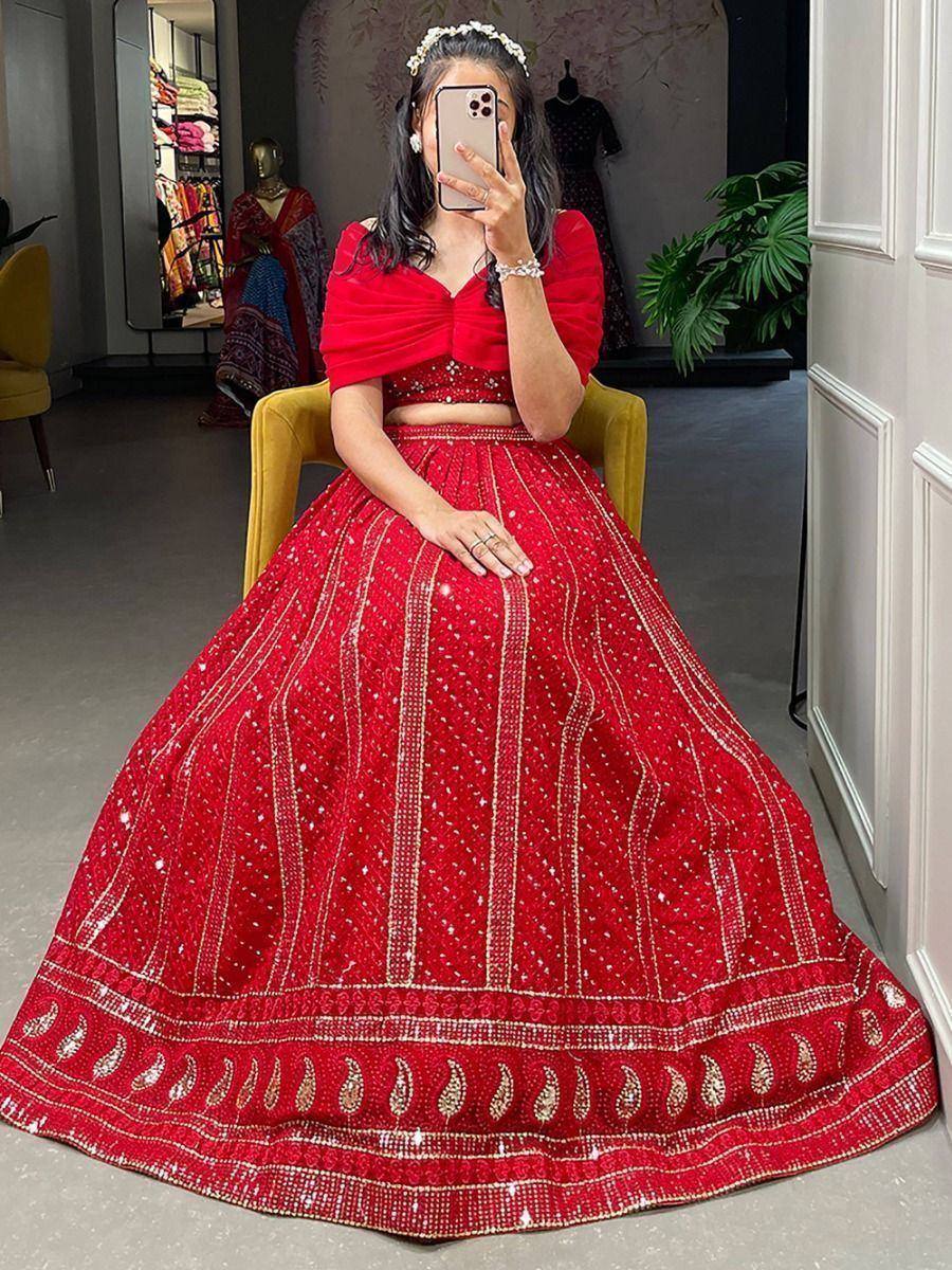 Red designer lehenga choli with gold embroidery, perfect for weddings and festive occasions