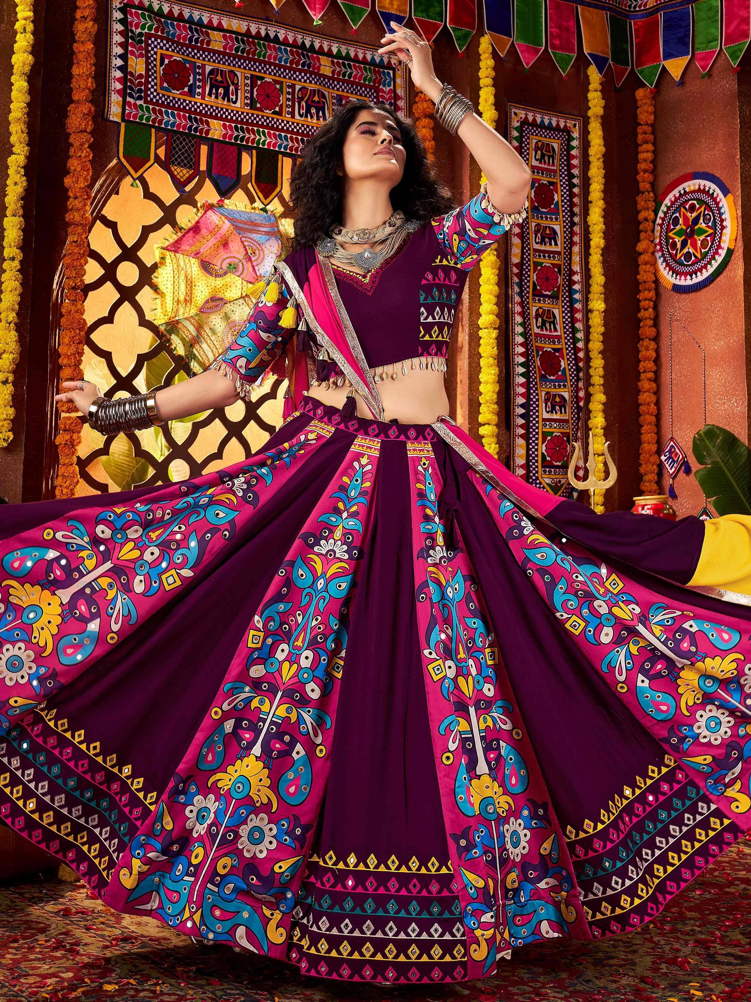 Vibrant purple and pink printed lehenga choli with peacock motifs, perfect for Indian ethnic wear and festive occasions.