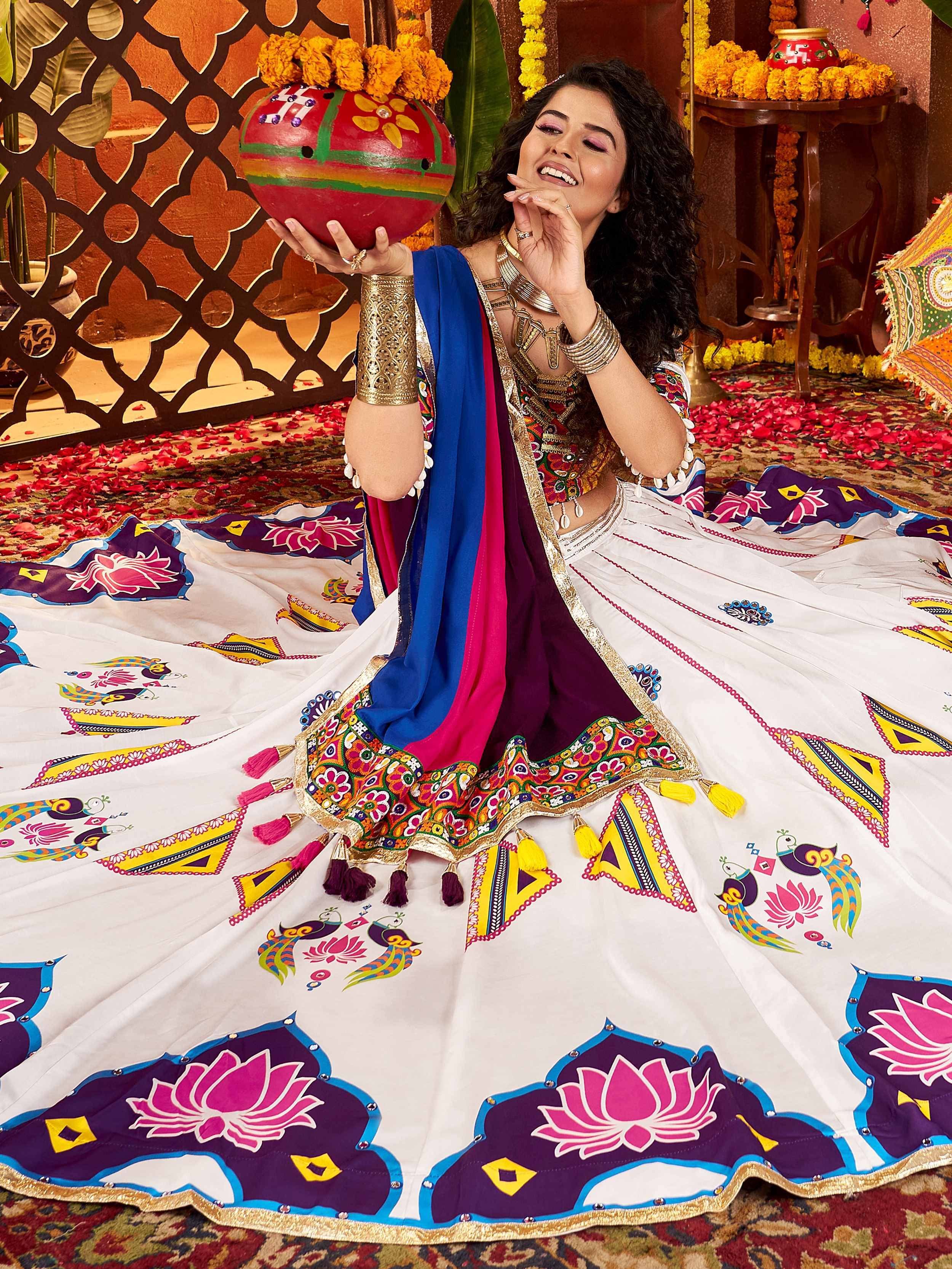 Woman in colorful Indian lehenga choli with peacock and lotus print, holding festive pot, perfect for ethnic celebrations