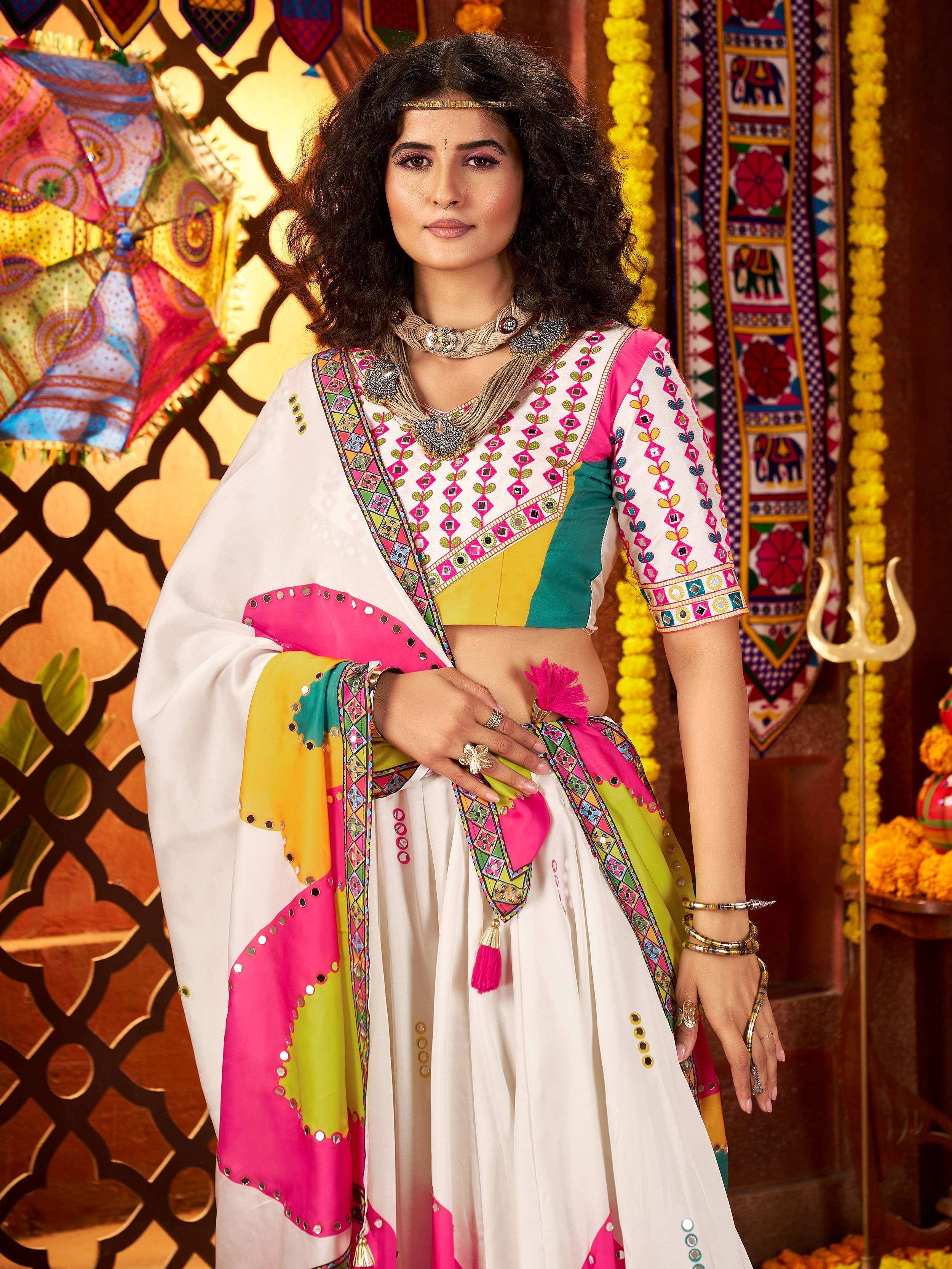 Colorful Indian ethnic wear with mirror work and vibrant dupatta, perfect for festive occasions.