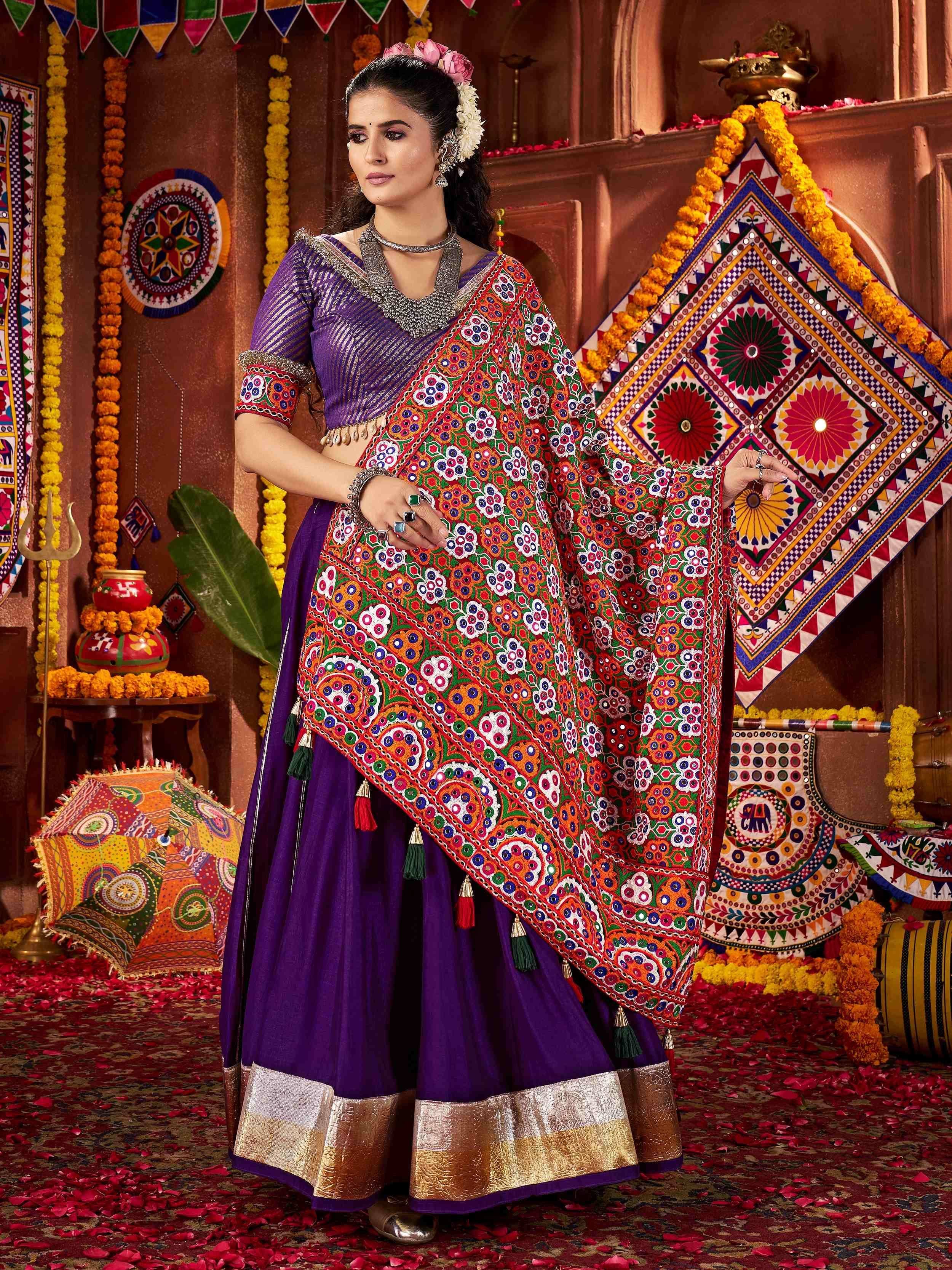 Purple ethnic lehenga choli with vibrant mirror work dupatta, traditional Indian festive wear