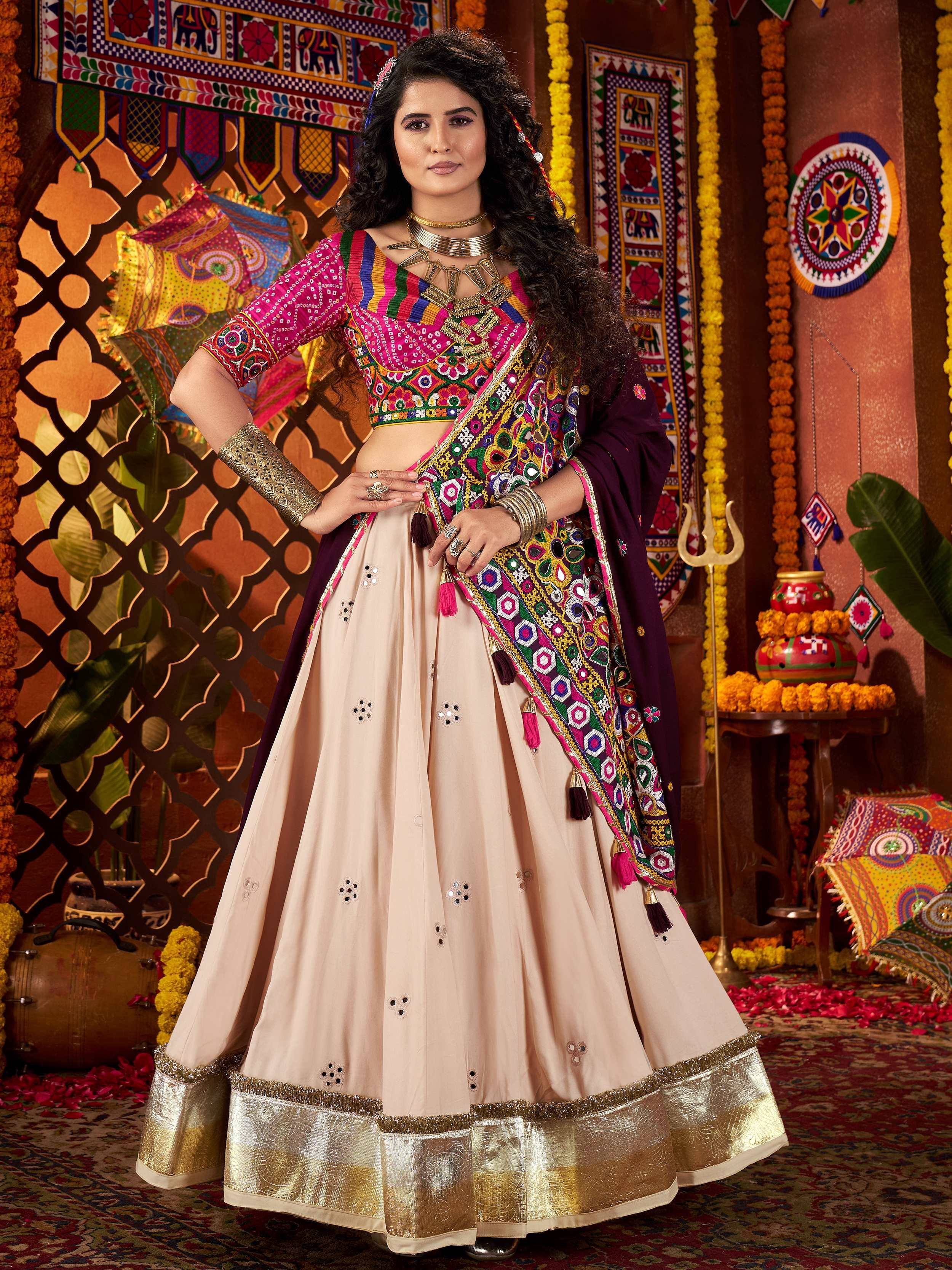 Woman in vibrant Indian ethnic lehenga choli with mirror work, perfect for festive occasions