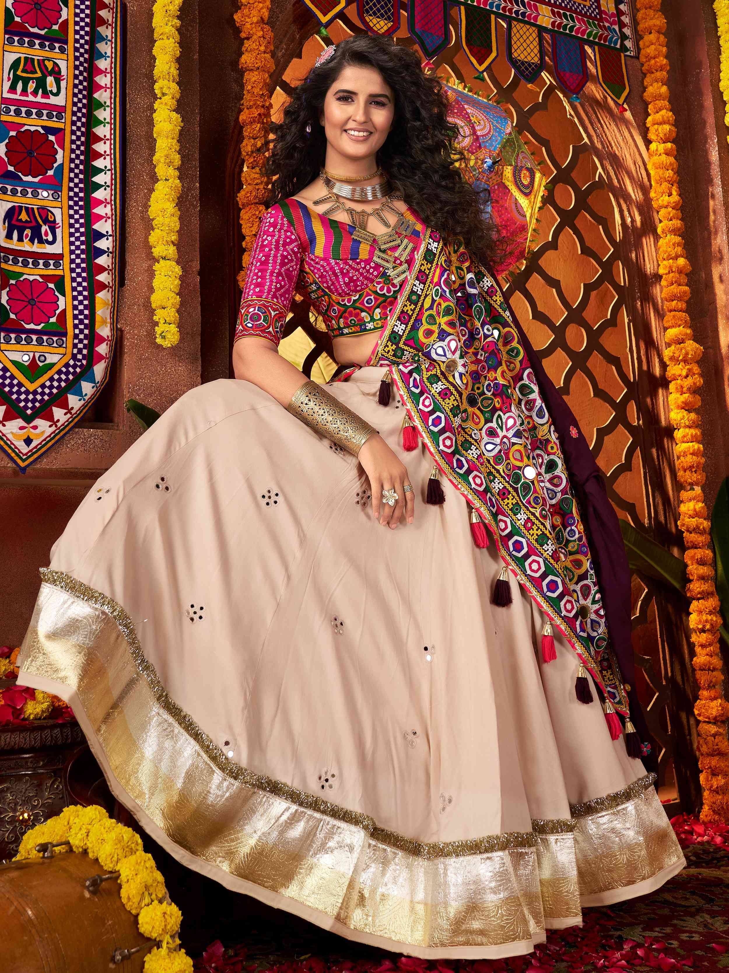 Vibrant Indian lehenga choli with colorful embroidery and gold border, perfect for festive occasions.