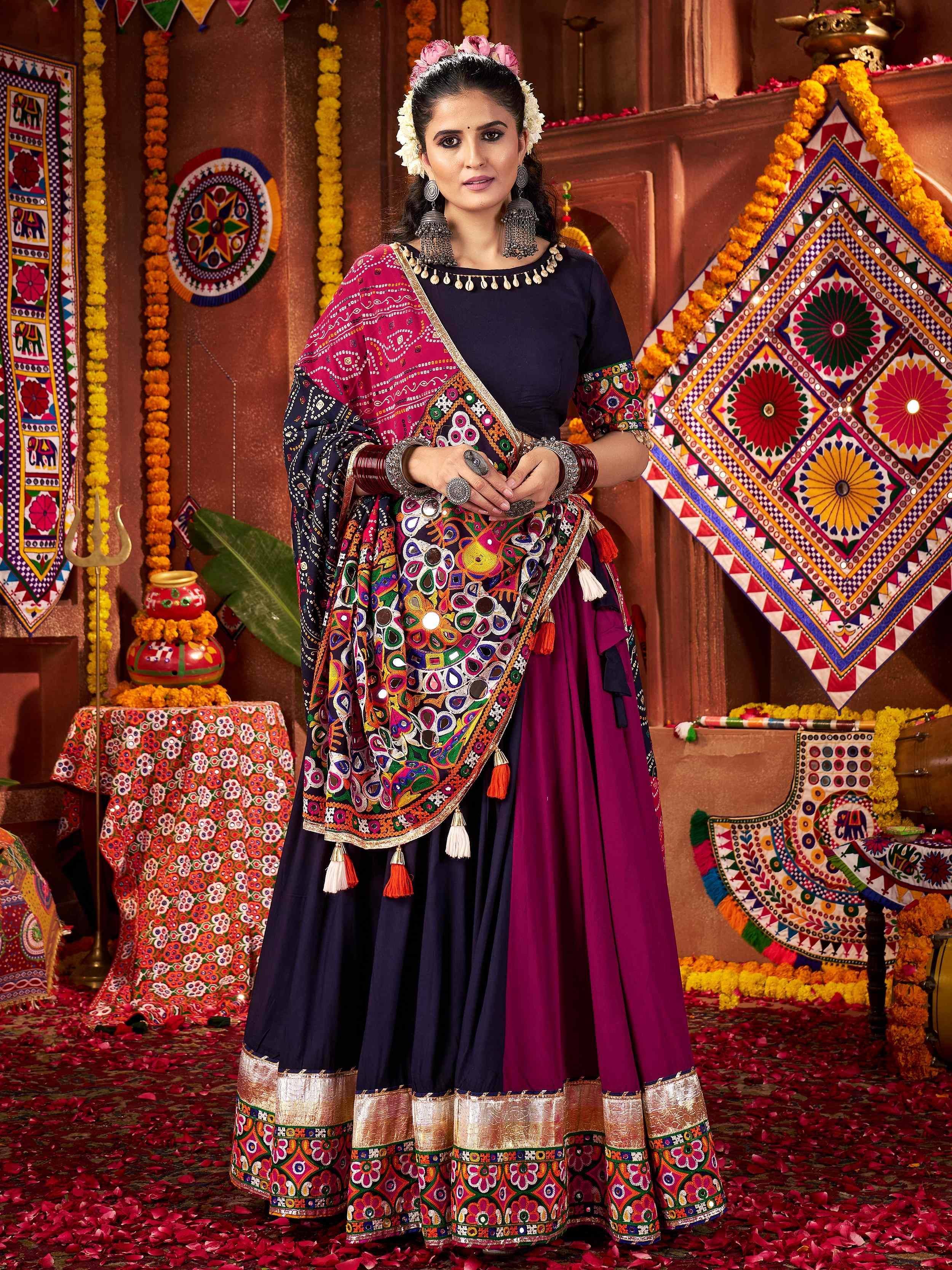 Vibrant Indian ethnic lehenga choli with mirror work, floral embroidery, and tassels for festive occasions