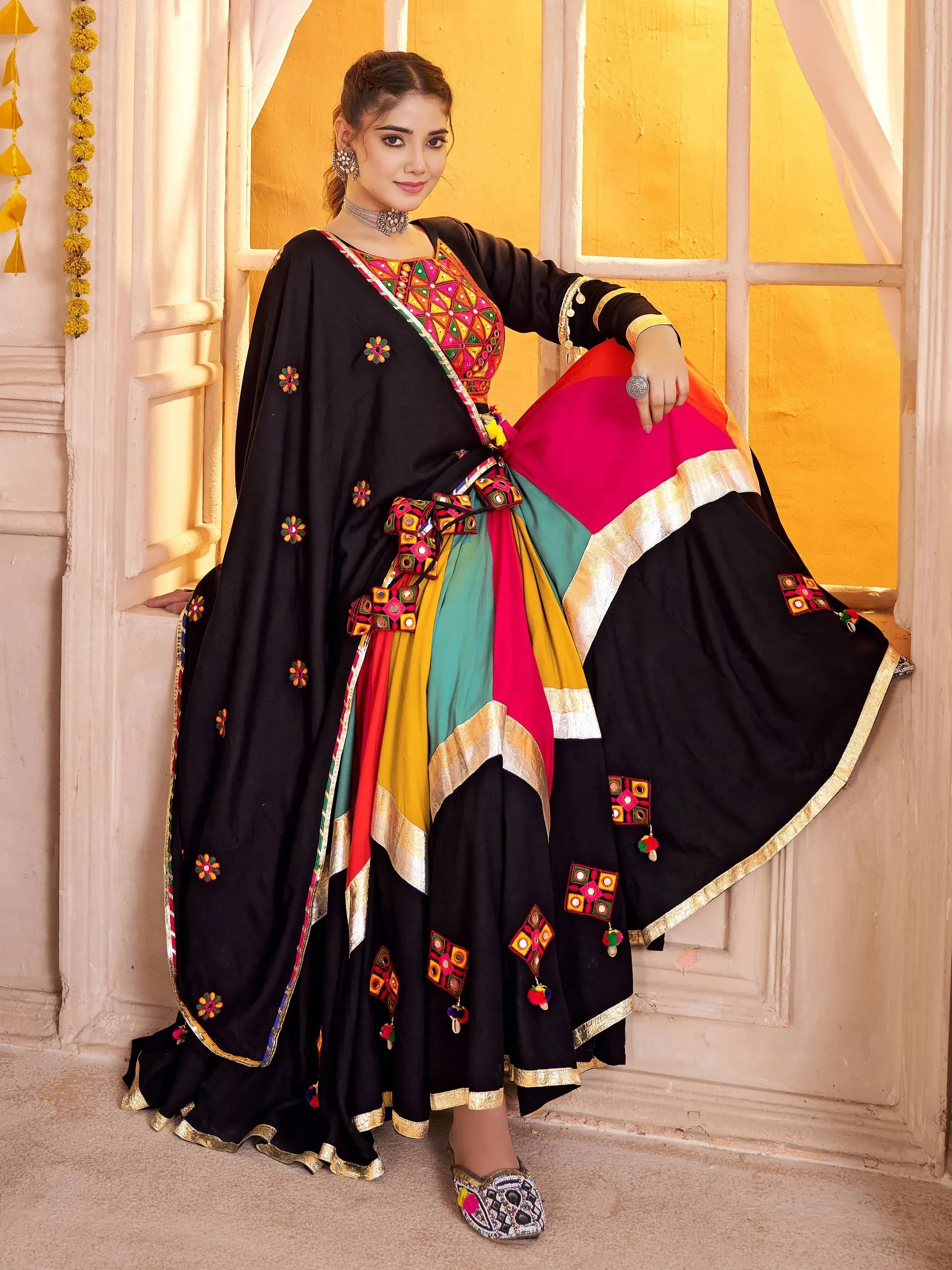 Black embroidered lehenga choli with colorful mirror work, perfect for Indian ethnic wear occasions