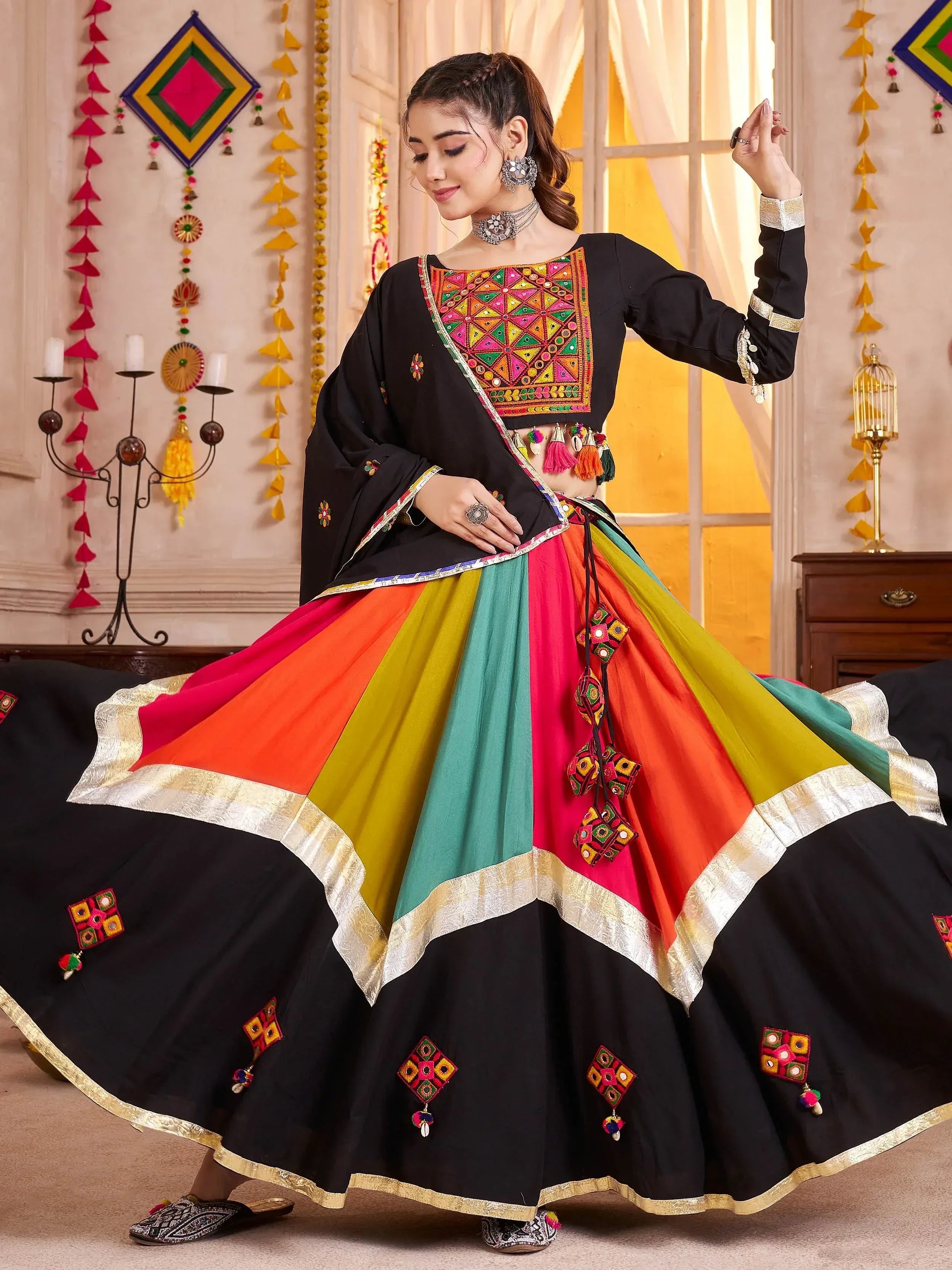 Black embroidered choli with colorful panelled lehenga, traditional Indian ethnic wear for festive occasions