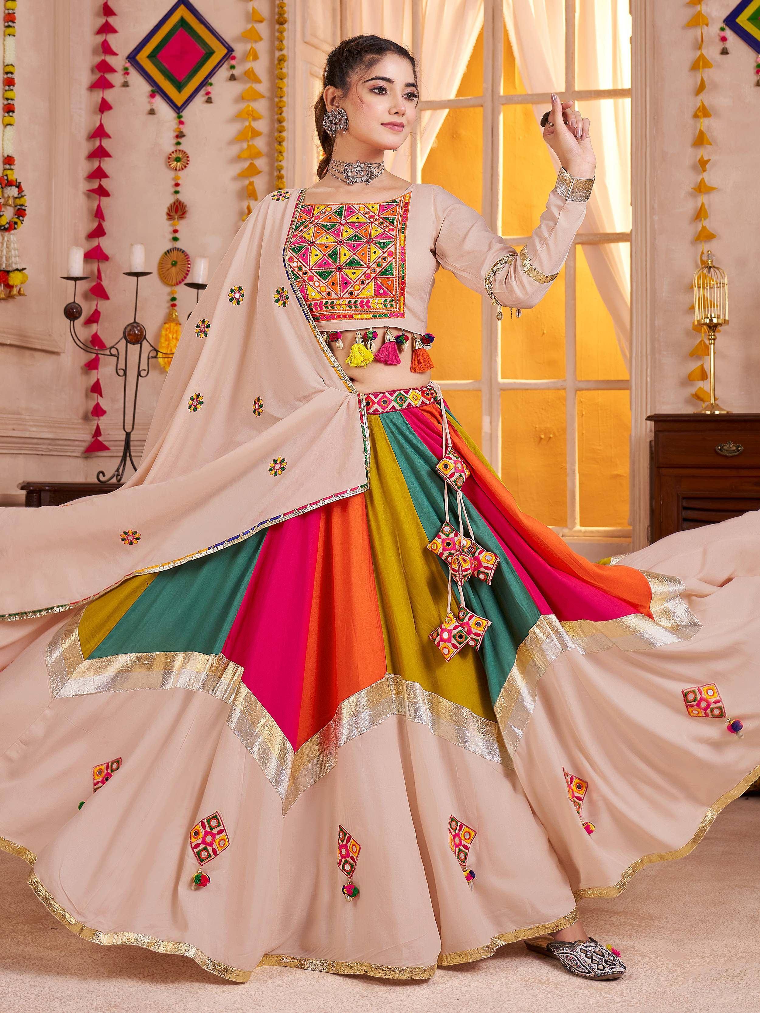 Colorful embroidered Indian lehenga choli with mirror work and tassels, perfect for festive occasions