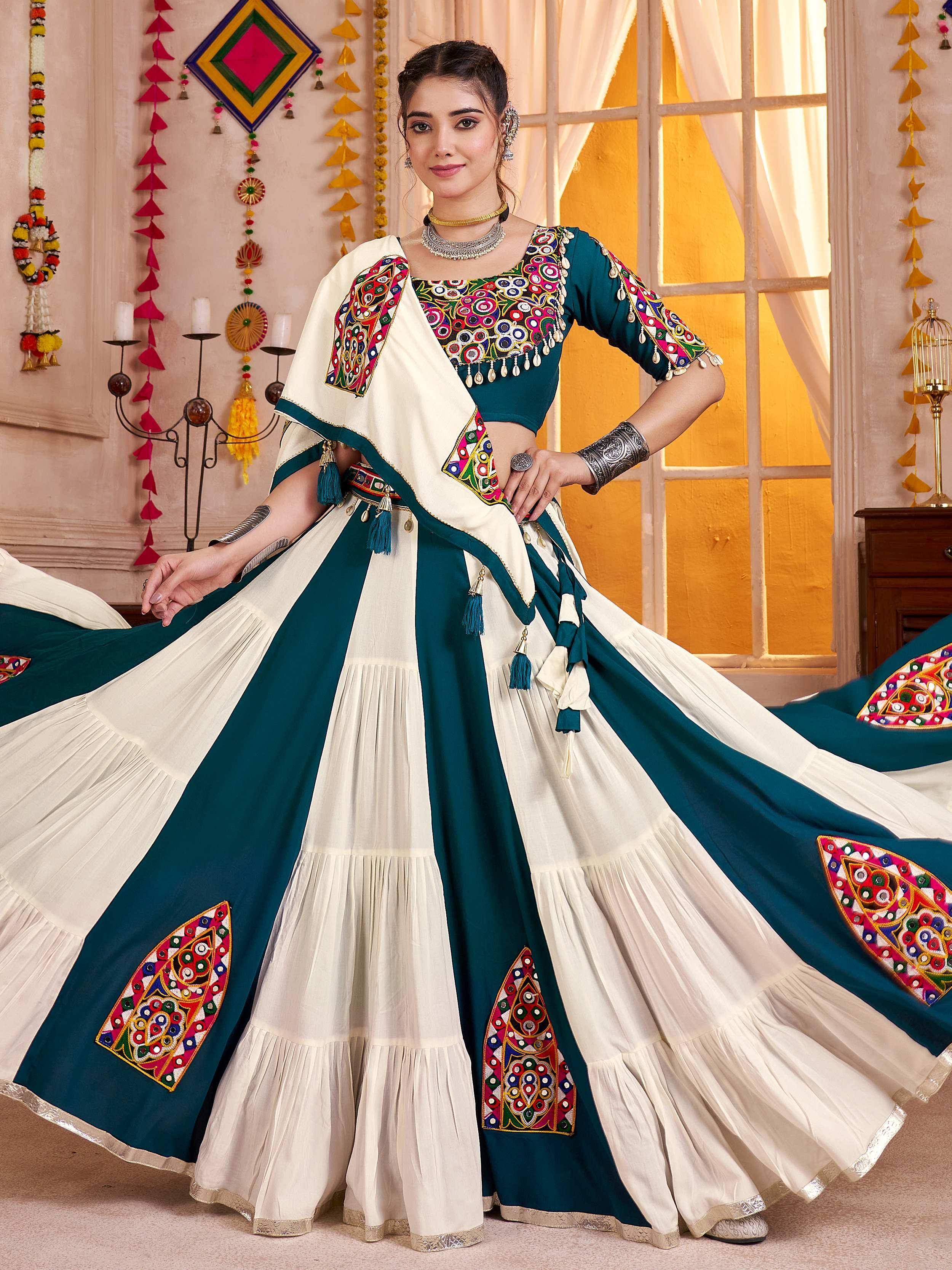 Teal and cream embroidered lehenga choli with mirror work, perfect for Indian ethnic wear occasions