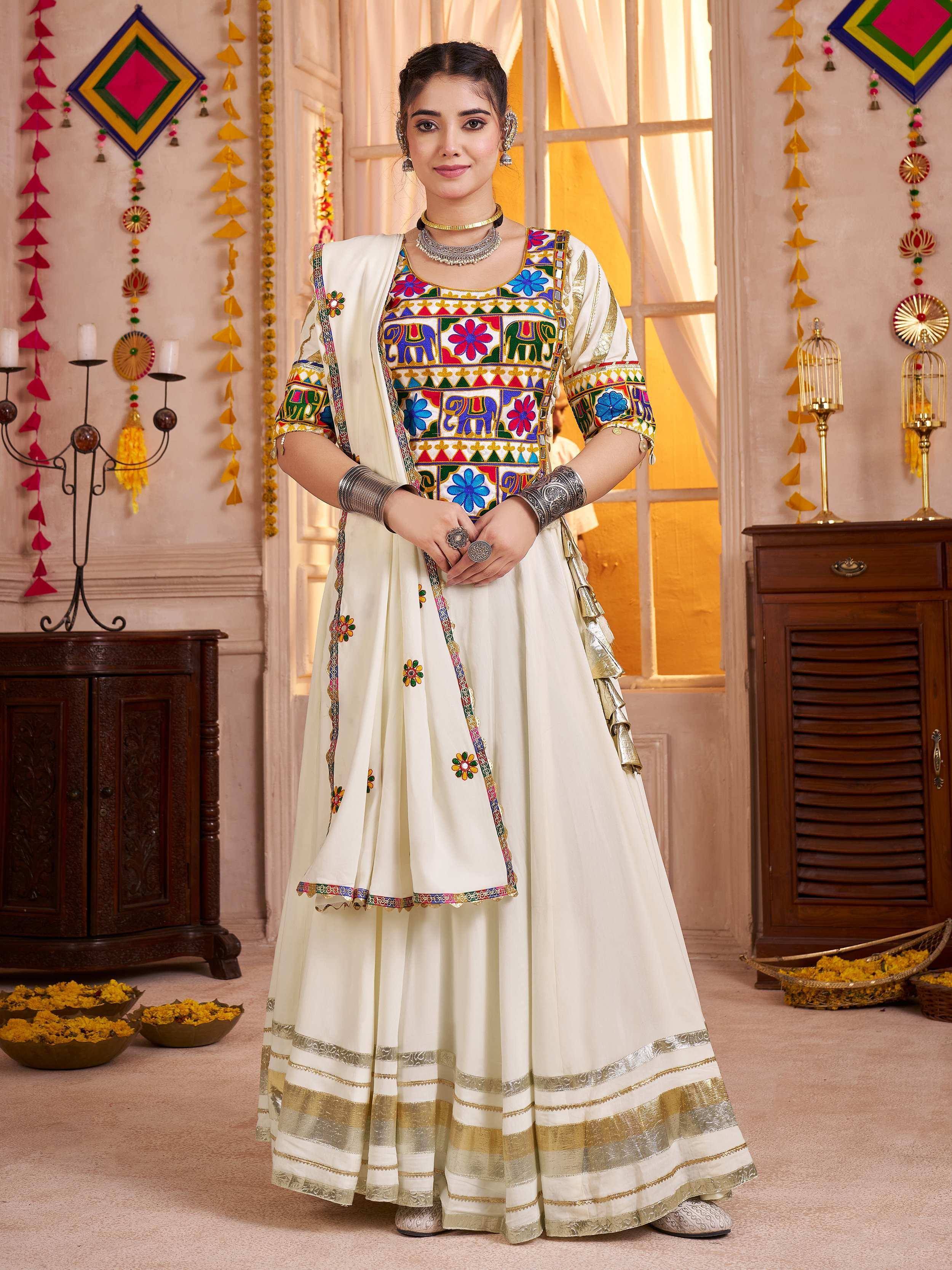 Elegant white embroidered lehenga choli with colorful motifs, perfect for festive occasions.