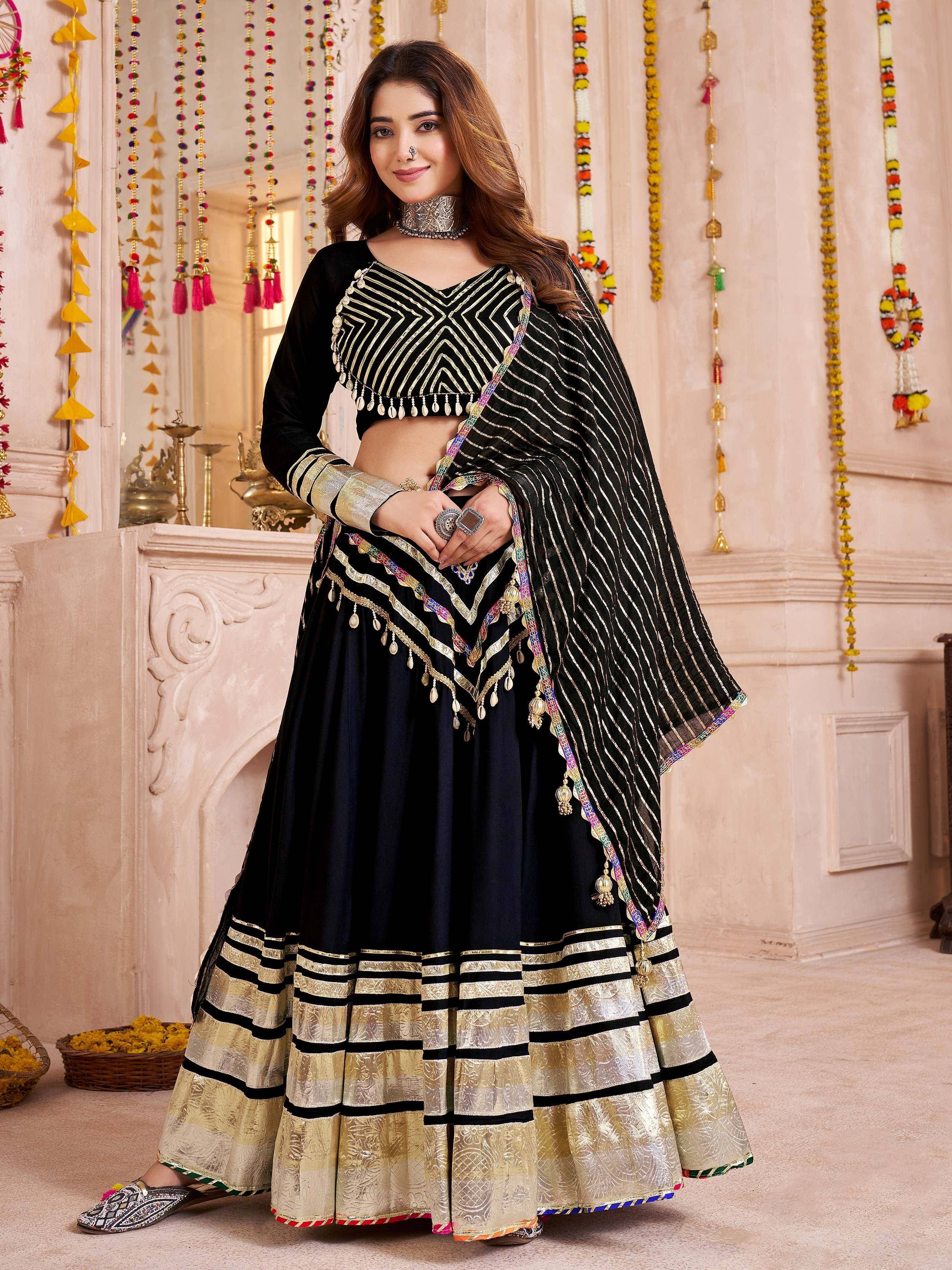 Black and gold ethnic lehenga choli with geometric embroidery and striped dupatta for Indian festive wear