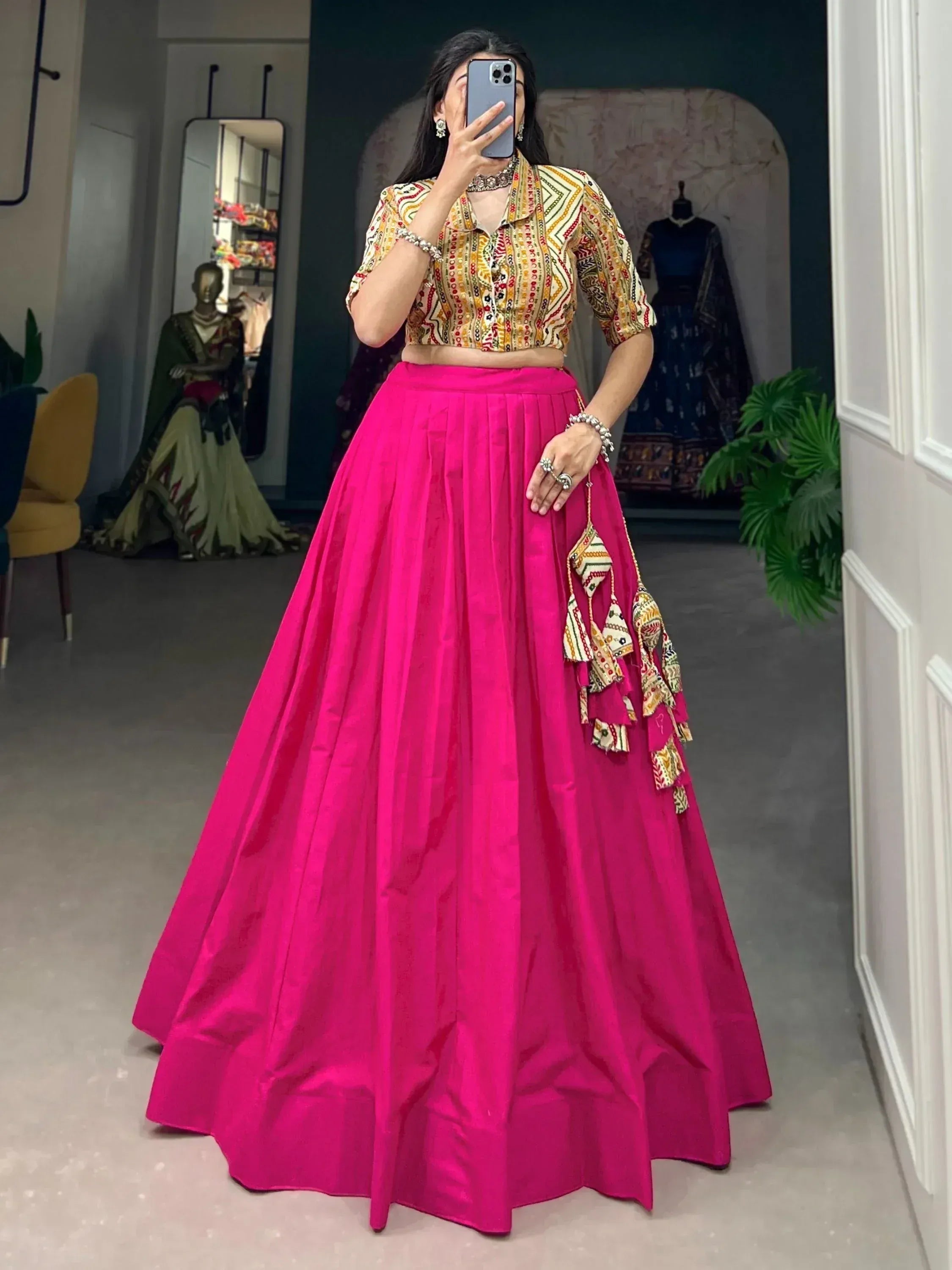 Vibrant pink lehenga with printed crop top, perfect for Indian ethnic wear and festive occasions.