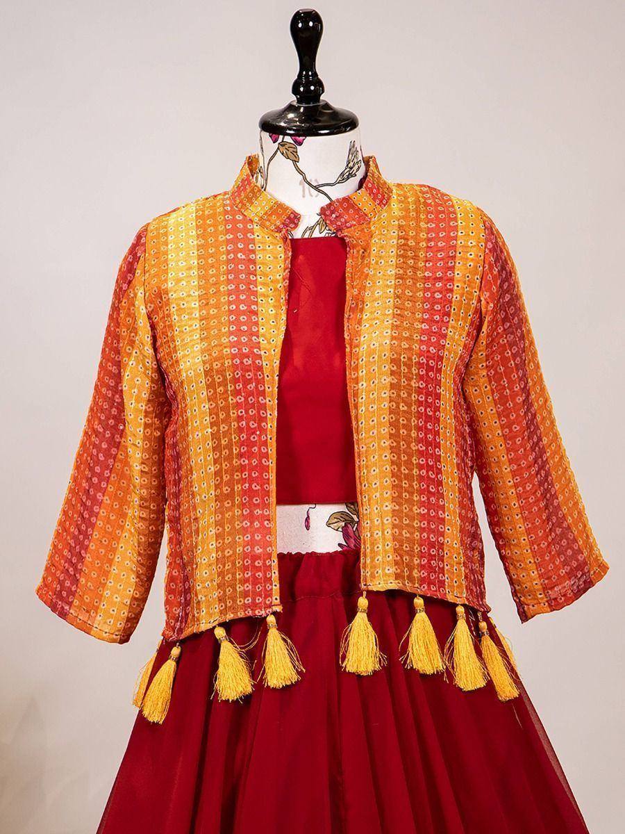 Orange and red printed jacket with tassels over maroon lehenga choli, ethnic Indian wear