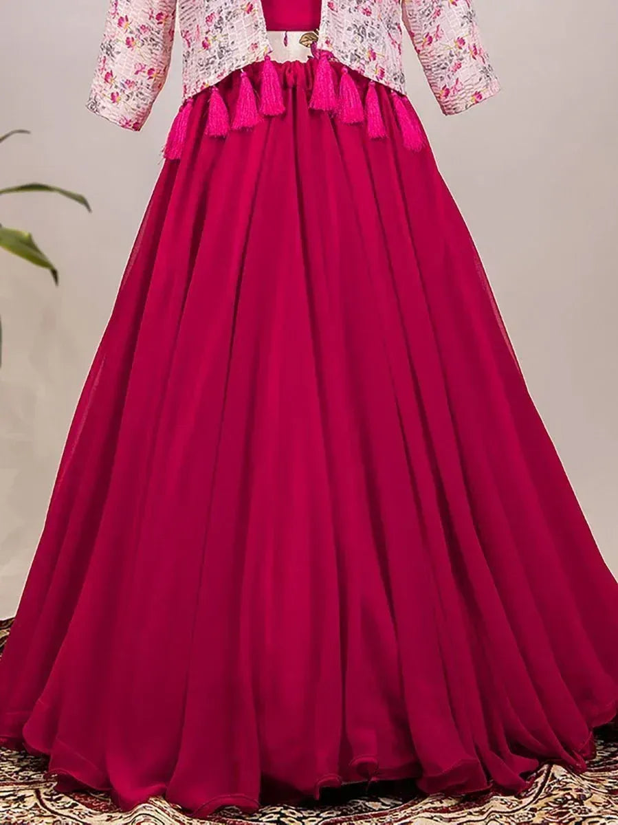 Fuchsia ethnic gown with floral jacket and tassels, perfect for Indian celebrations
