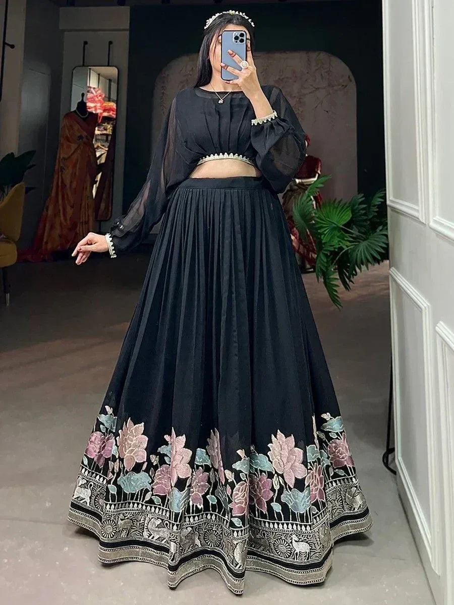 Black floral embroidered lehenga choli with sheer blouse, perfect for Indian ethnic wear occasions.