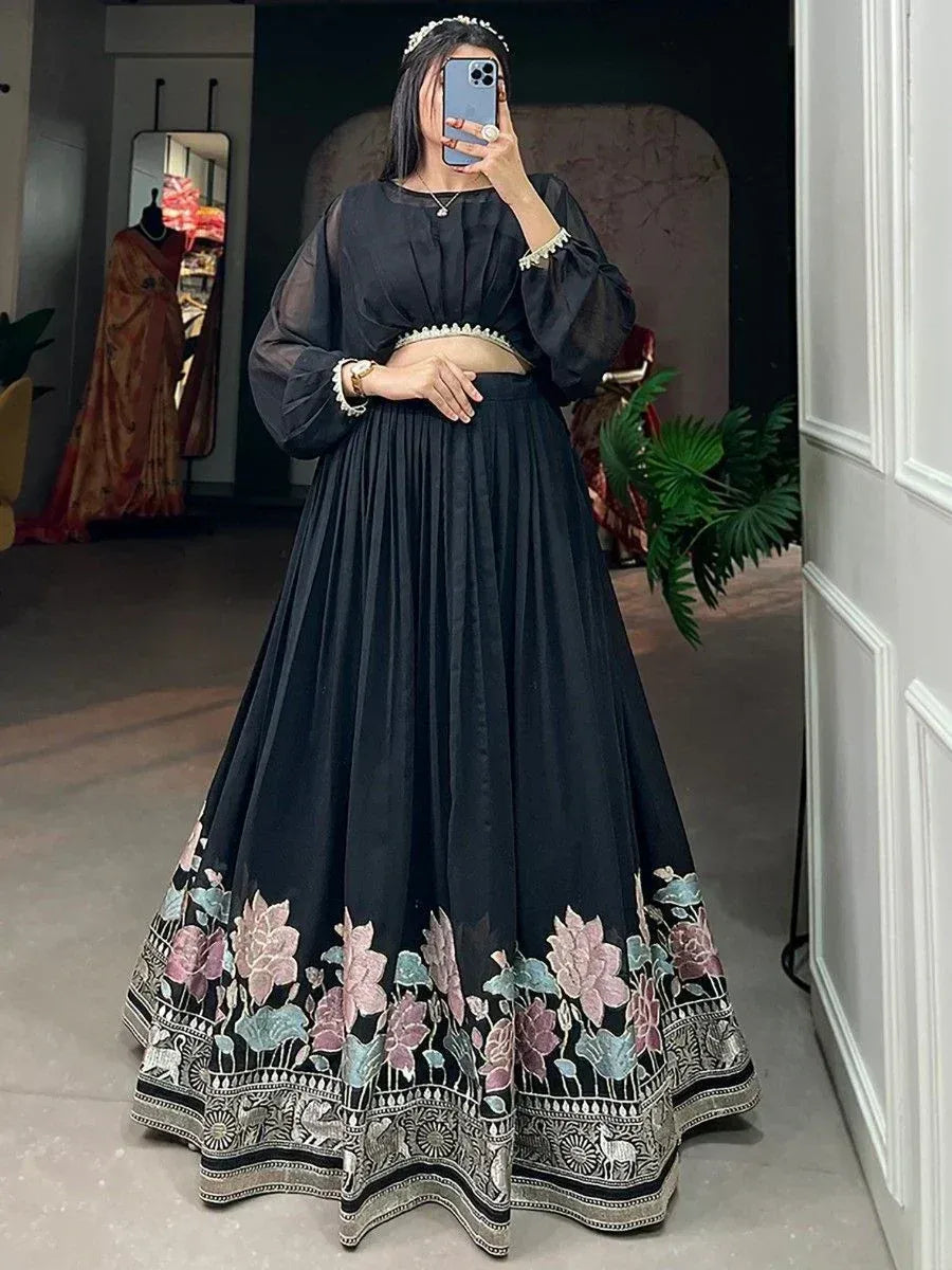 Black floral embroidered lehenga choli with sheer sleeves, perfect for Indian ethnic wear occasions