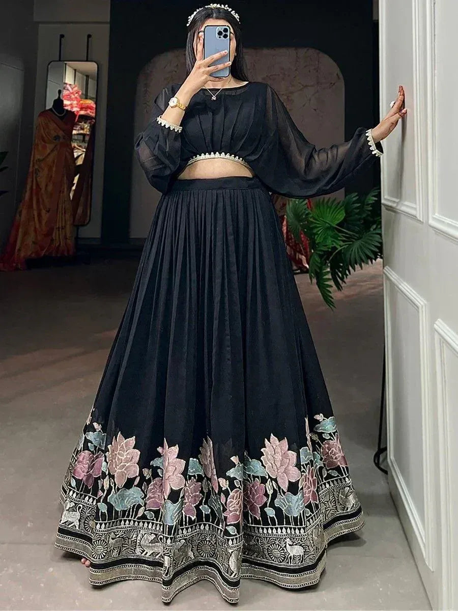 Black floral embroidered lehenga choli with sheer sleeves, perfect for Indian ethnic wear occasions.